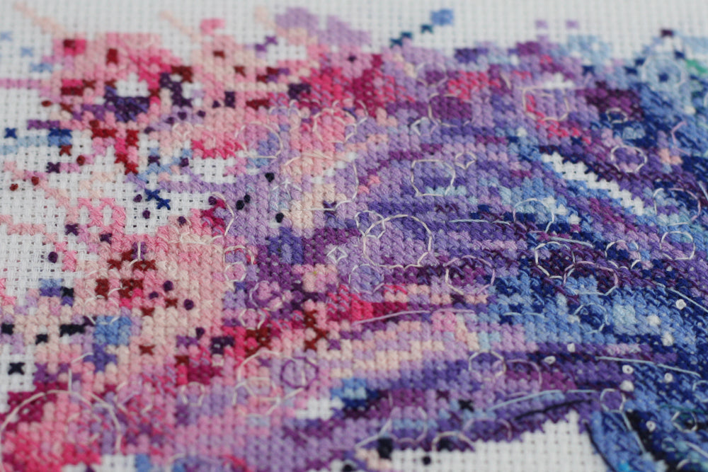 Cross-stitch kit Cha-cha-cha AH-092 featuring cotton canvas, colorful floss, and needles for crafting.