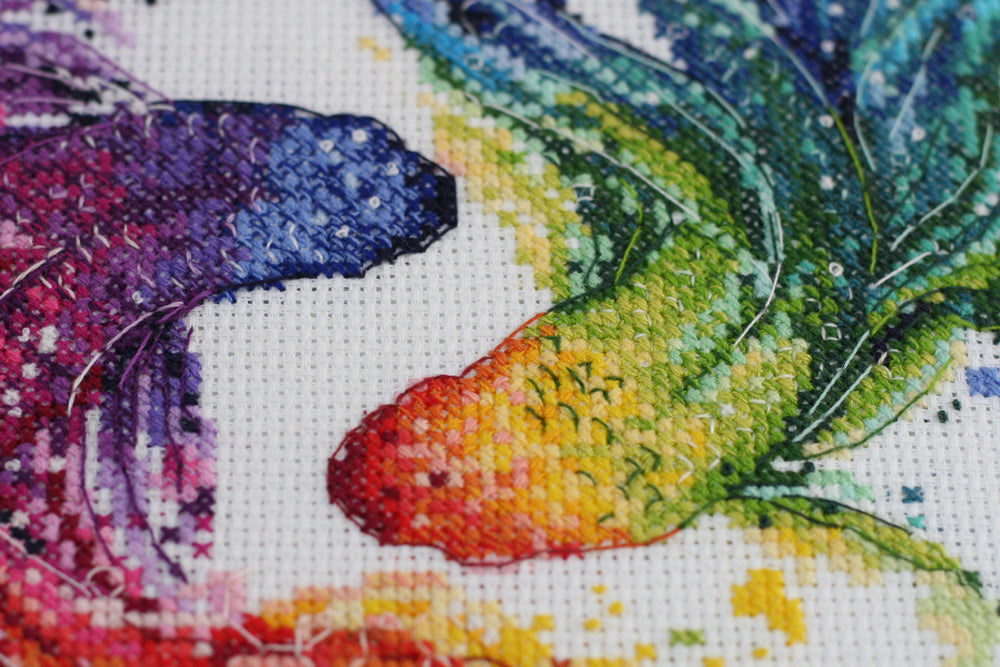 Cross-stitch kit Cha-cha-cha AH-092 featuring cotton canvas, colorful floss, and needles for crafting.