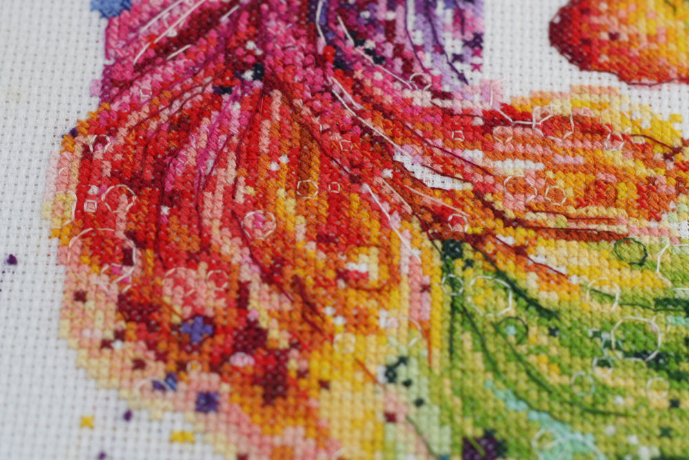 Cross-stitch kit Cha-cha-cha AH-092 featuring cotton canvas, colorful floss, and needles for crafting.