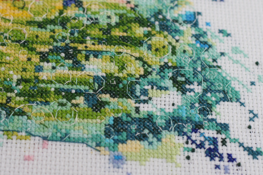 Cross-stitch kit Cha-cha-cha AH-092 featuring cotton canvas, colorful floss, and needles for crafting.