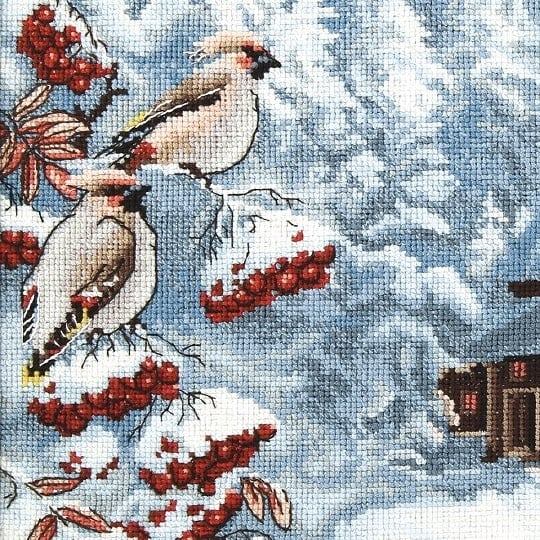 Cross-stitch kit M-385C 'Frosty evening' featuring colorful threads, Aida canvas, and instructions for crafting.