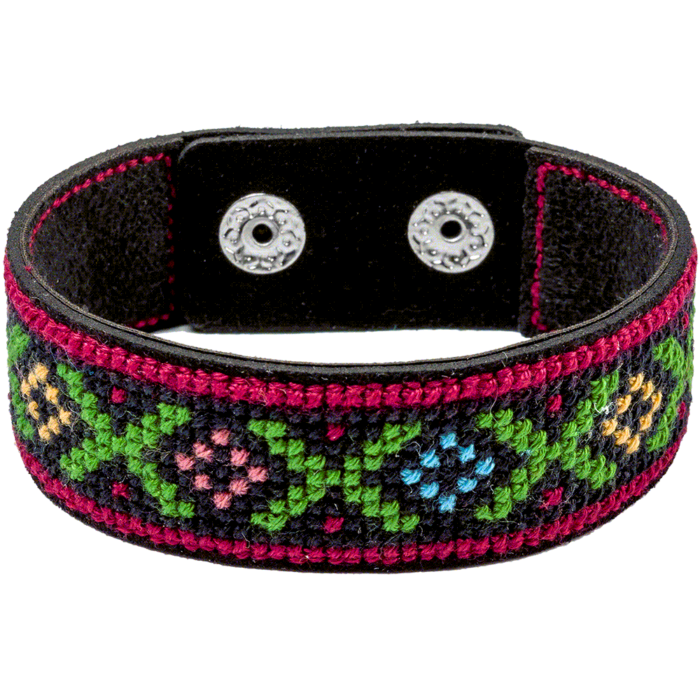 Cross-stitch kit on artificial leather FLHL-028 with materials for creating a bracelet, including cotton floss and needle.