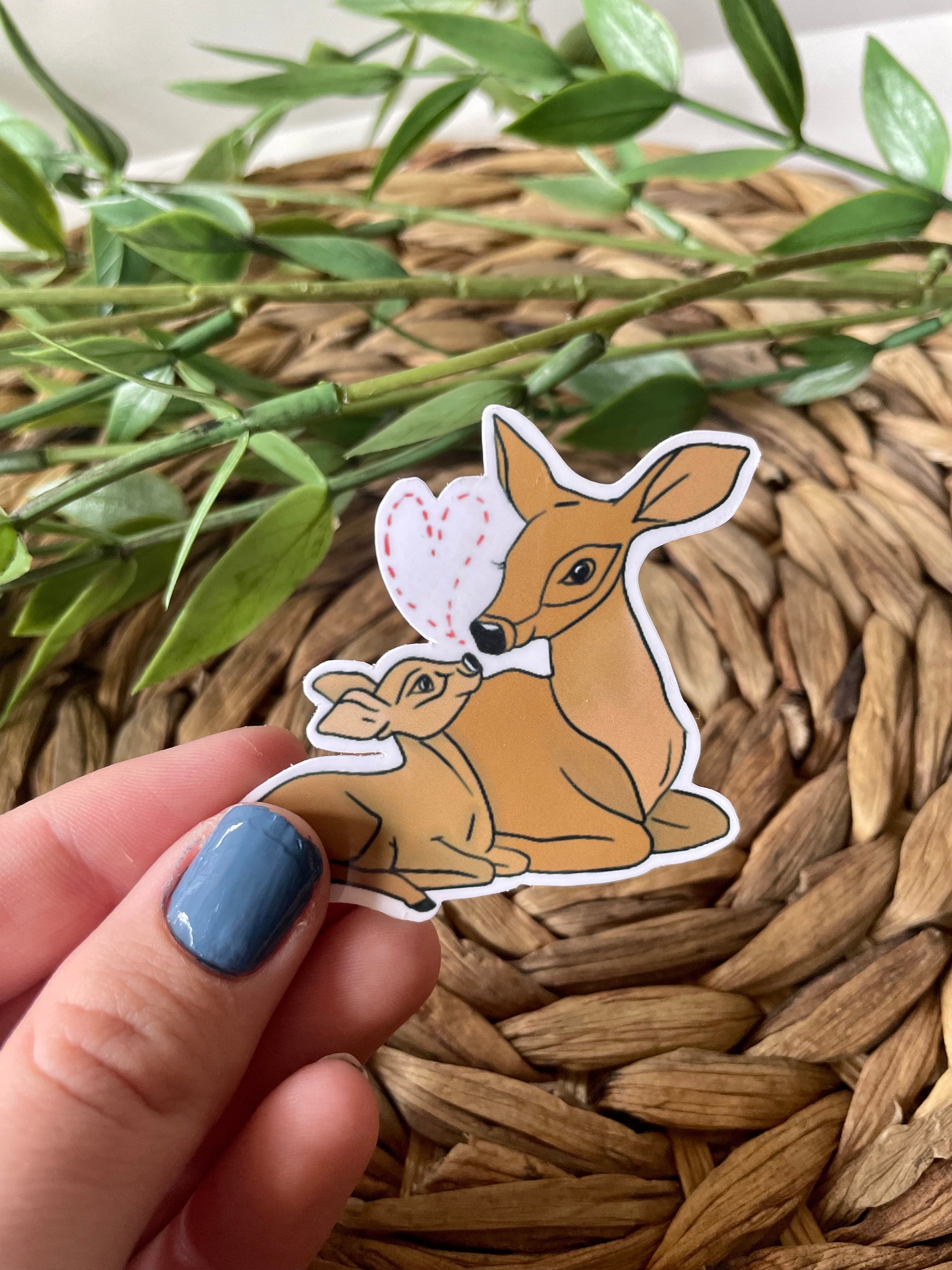 A cute deer and fawn sticker featuring a charming illustration, perfect for personalizing items.