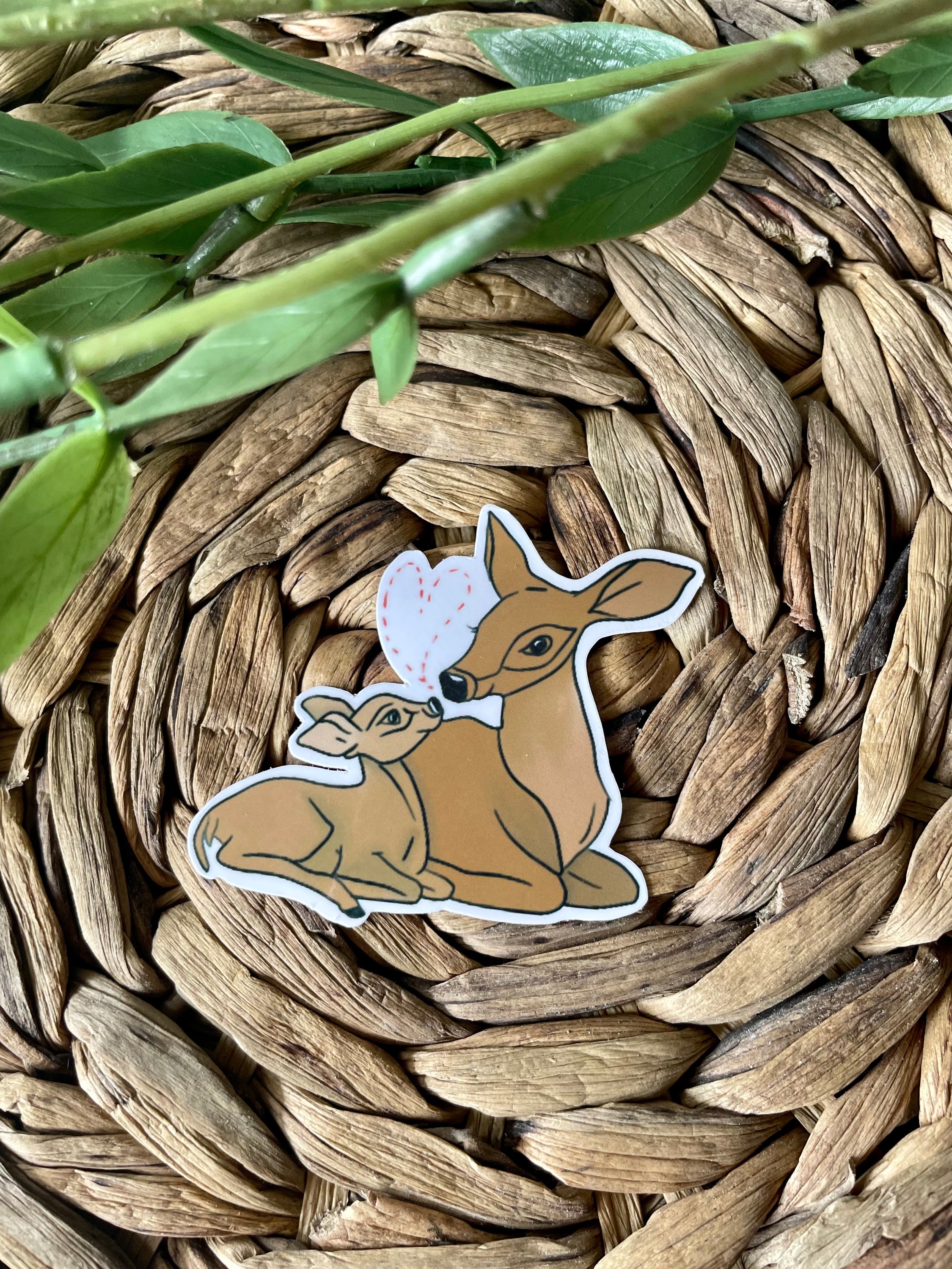 A cute deer and fawn sticker featuring a charming illustration, perfect for personalizing items.