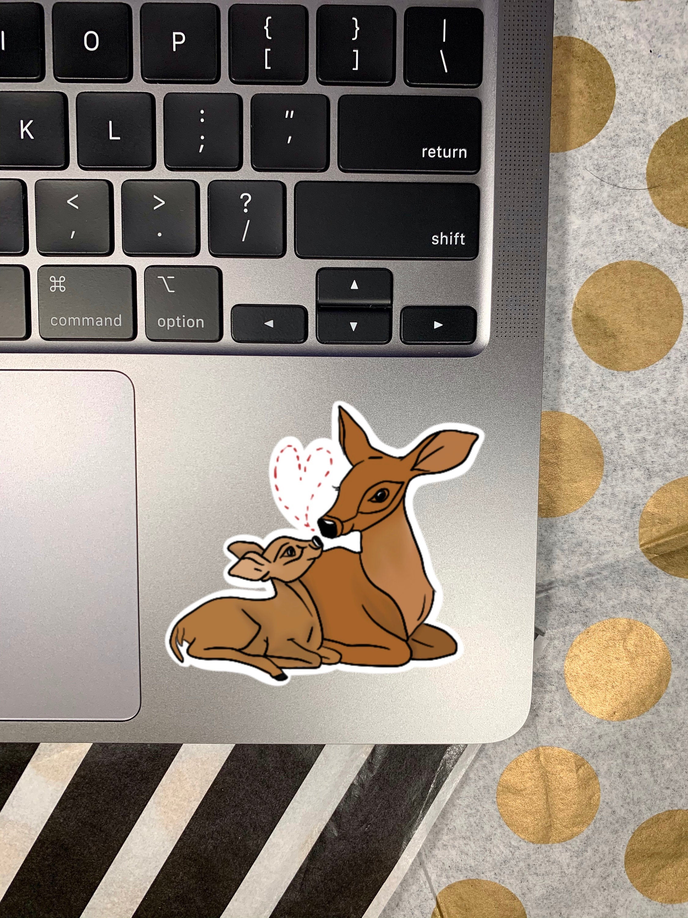 A cute deer and fawn sticker featuring a charming illustration, perfect for personalizing items.