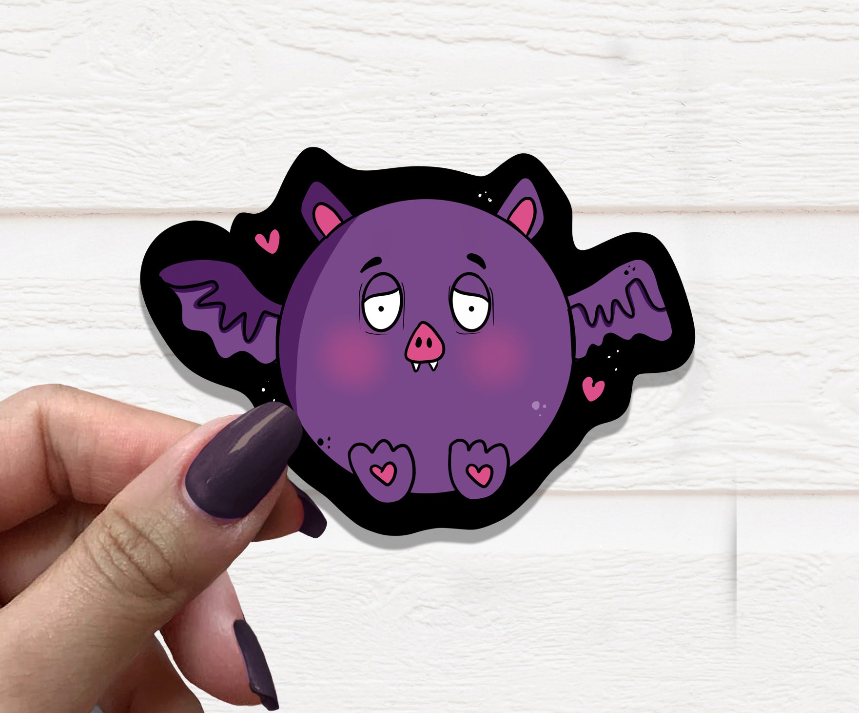 A cute Derpy Bat Vinyl Sticker featuring a whimsical bat design, perfect for personalizing various items.