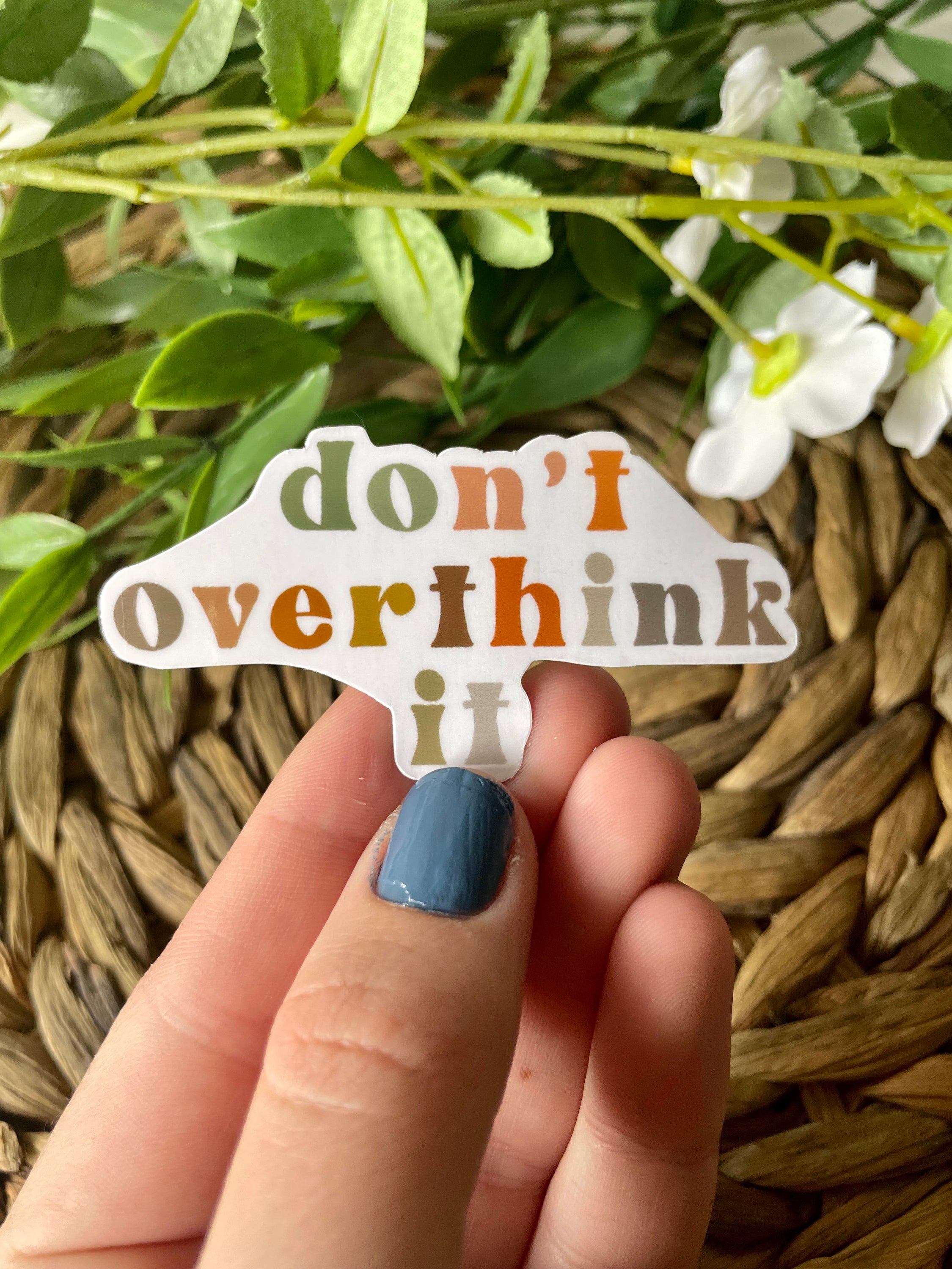 A colorful 'Don't Overthink It' sticker on a white background, featuring motivational text and a stylish design.