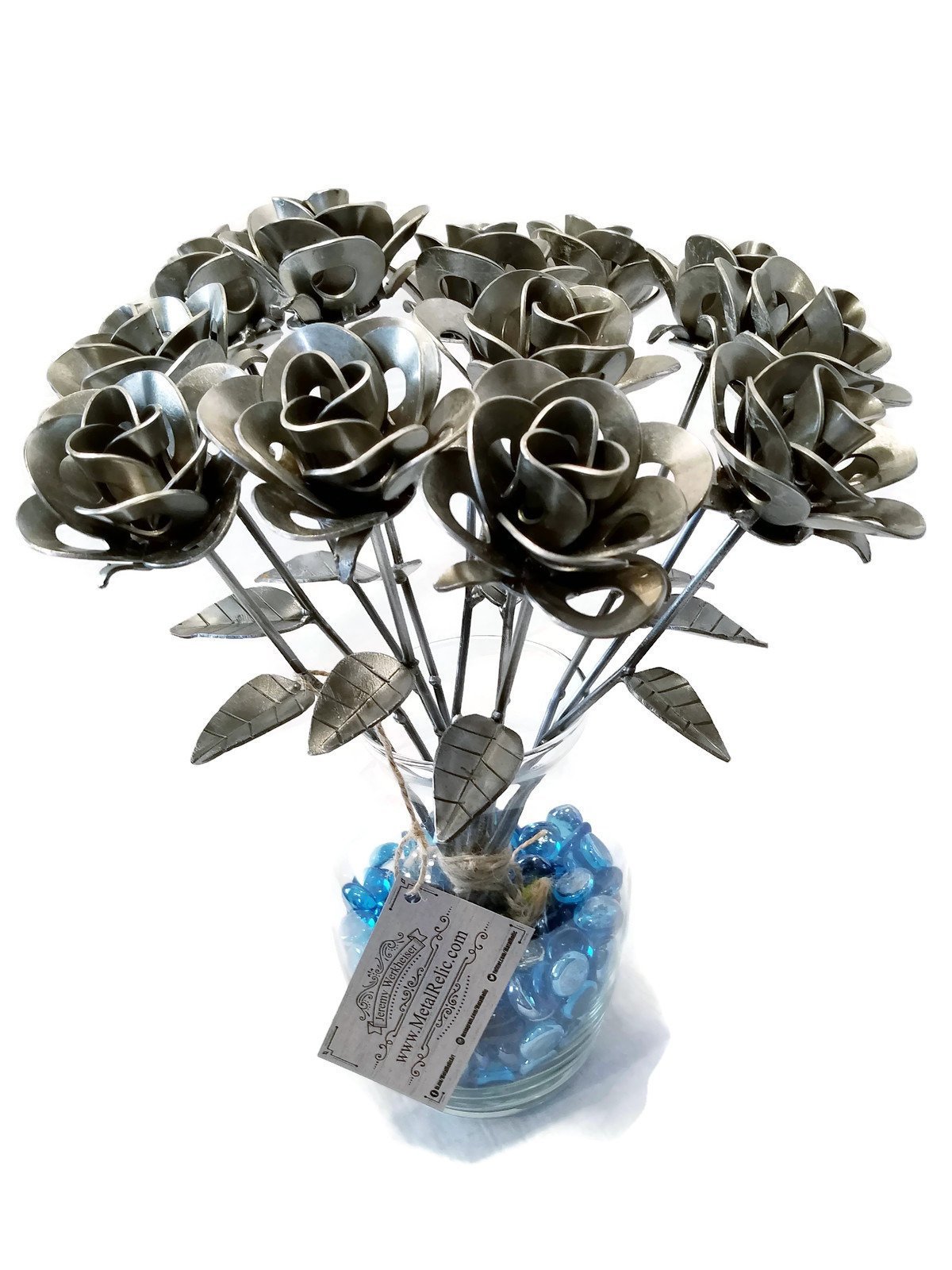 A dozen handcrafted metal roses made from recycled washers and wire, showcasing unique designs and a shiny lacquer finish, perfect for gifting.