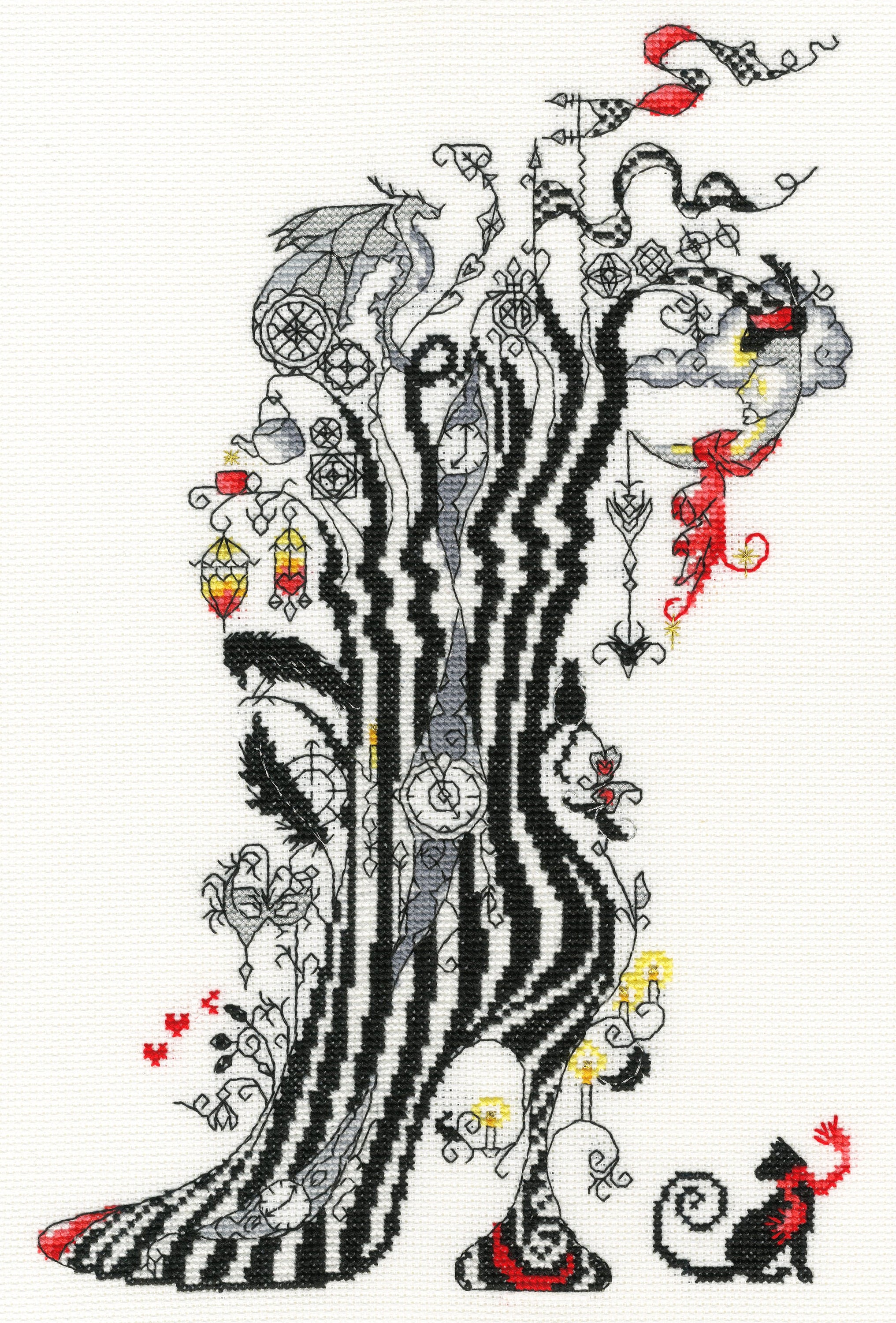 Dream XSK8 Counted Cross Stitch Kit featuring white Aida fabric, colorful threads, and stitching tools.