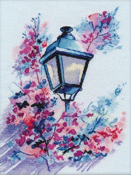 Evening Light 1118 Counted Cross Stitch Kit featuring Aida canvas, colorful threads, and a needle for crafting.