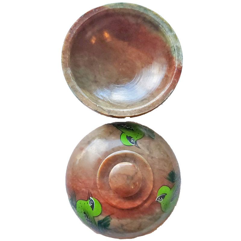 A handcrafted soapstone pot featuring a charming bird design, measuring 4 inches in length and width, perfect for indoor or outdoor decor.