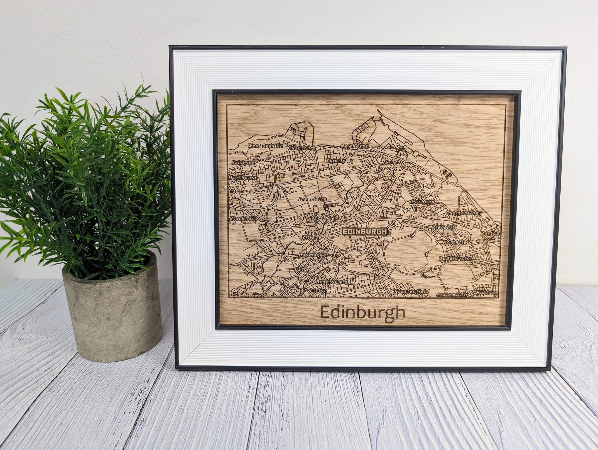 Framed Wooden Edinburgh Map showcasing intricate cityscape details in high-quality oak with a stylish monochrome frame.