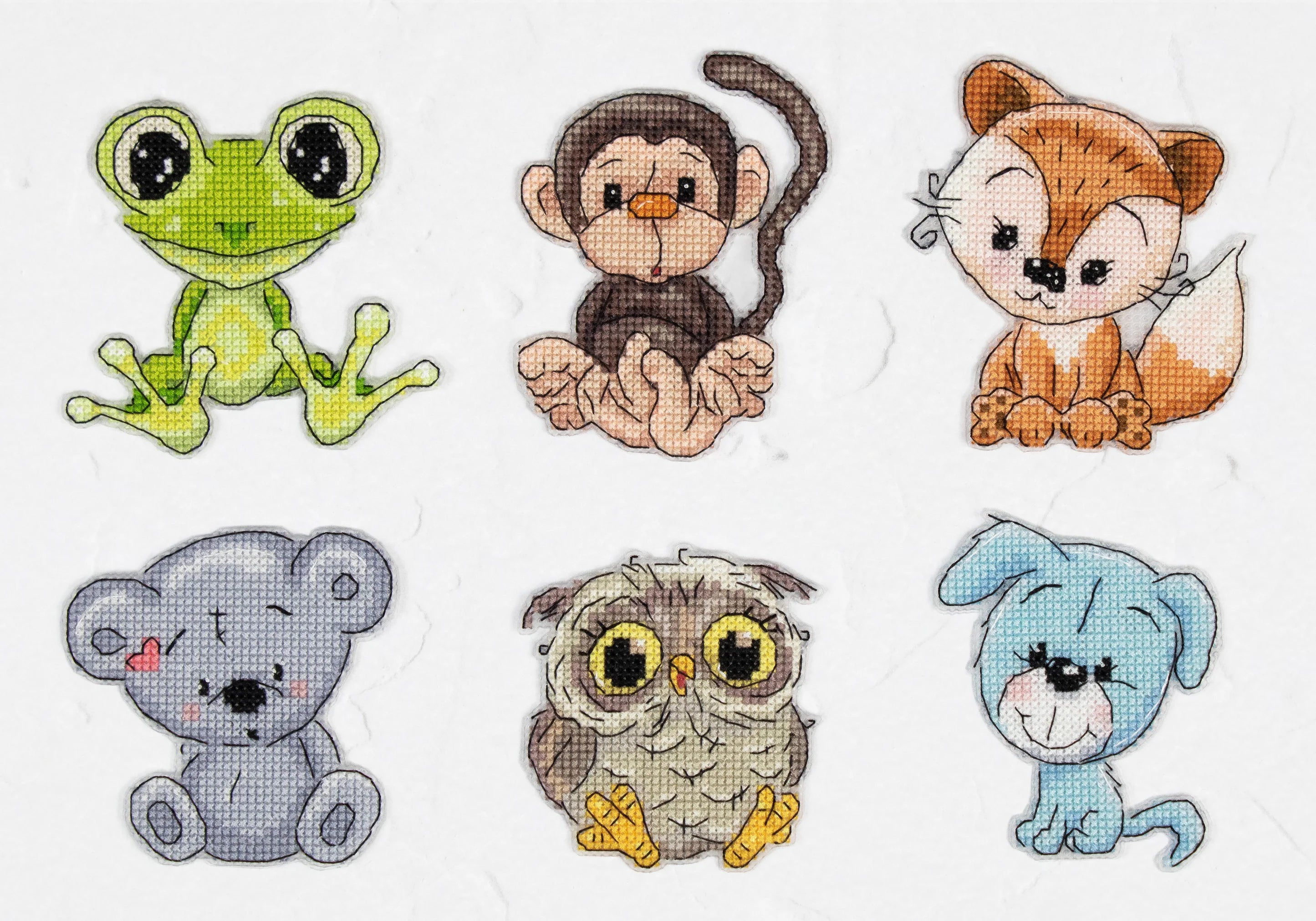 Friends 1 JK038L Counted Cross-Stitch Kit with colorful threads, needle, and plastic canvas.