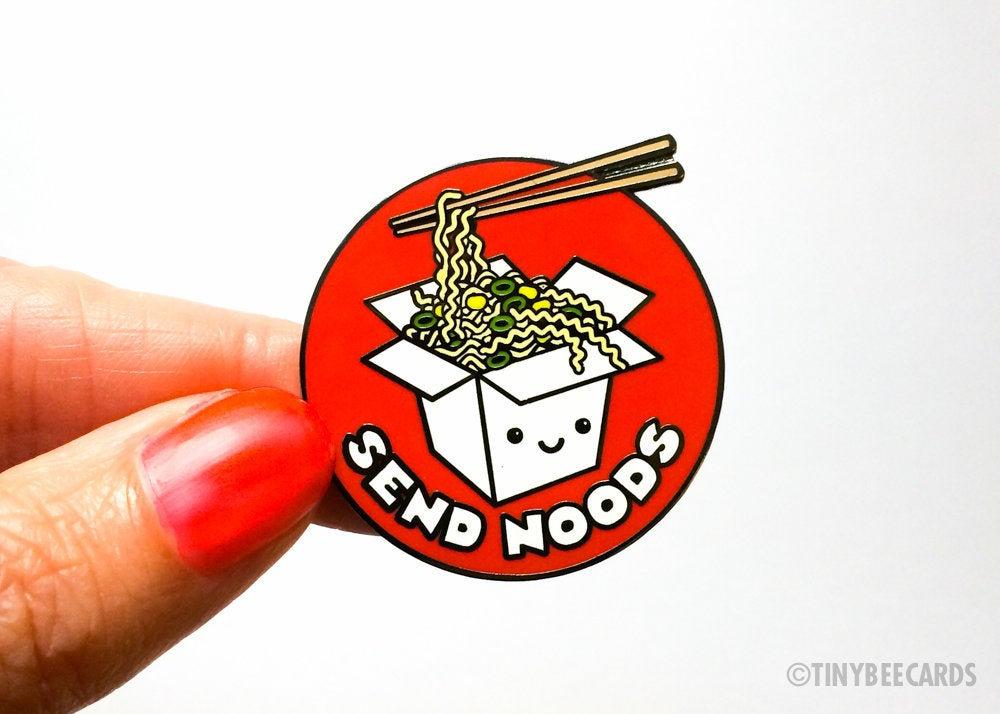 Funny Ramen Hard Enamel Pin featuring kawaii ramen noodles and the text 'Send Noods' on a black nickel background.