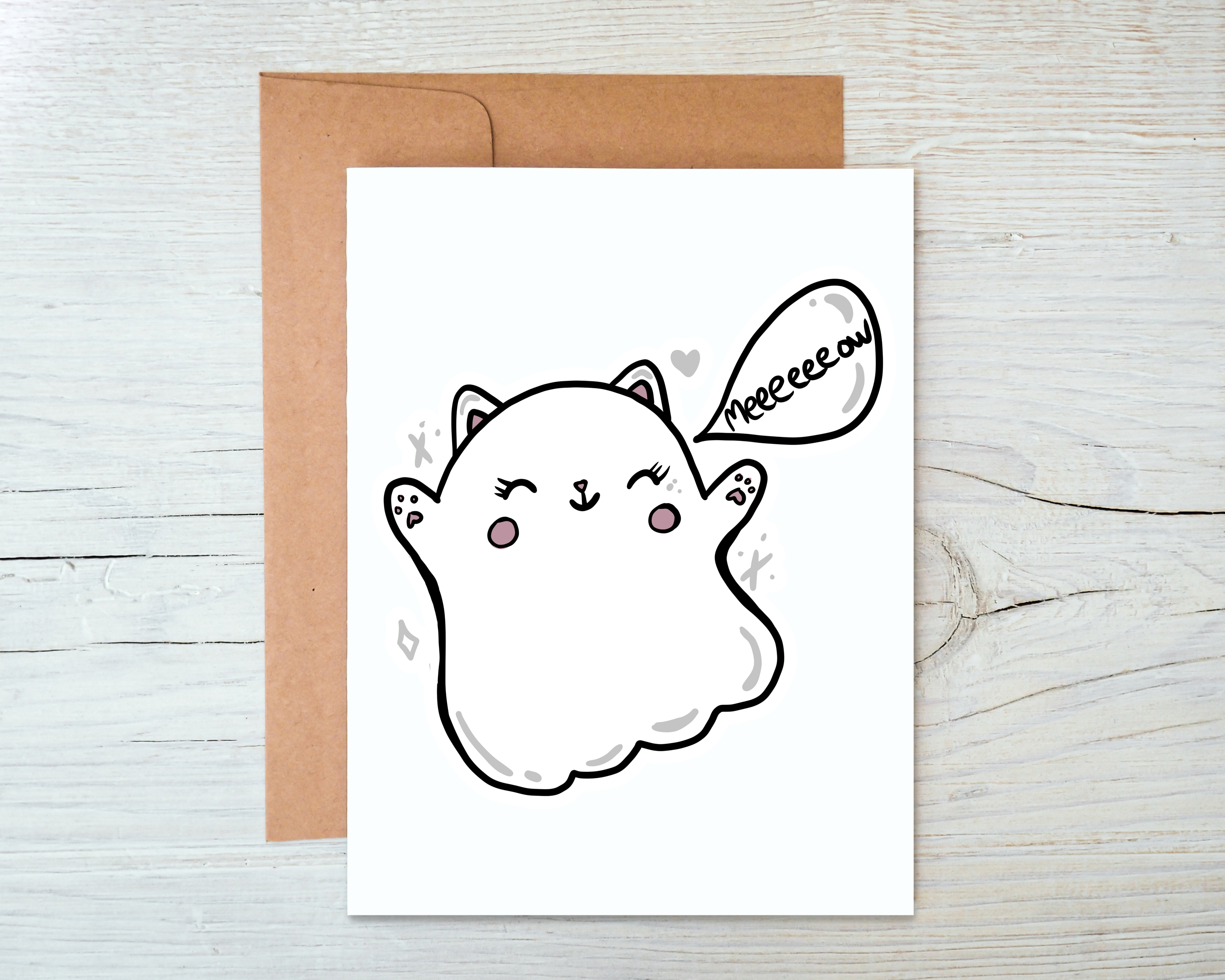 A whimsical Ghost Cat Card featuring a playful ghost cat design on the front, with a blank interior and a kraft envelope.