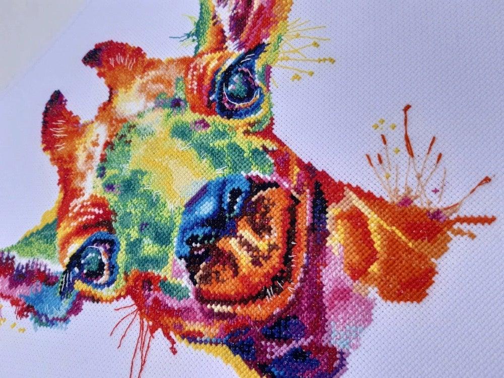 Giraffe 1434 Counted Cross Stitch Kit with colorful threads and canvas.