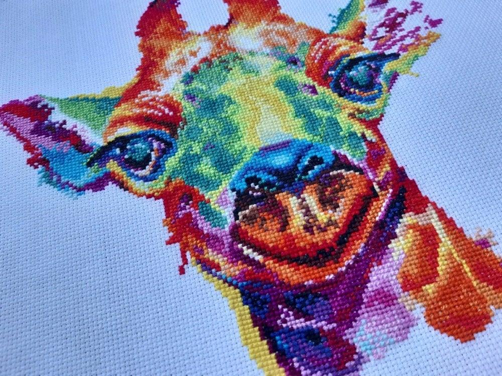 Giraffe 1434 Counted Cross Stitch Kit with colorful threads and canvas.