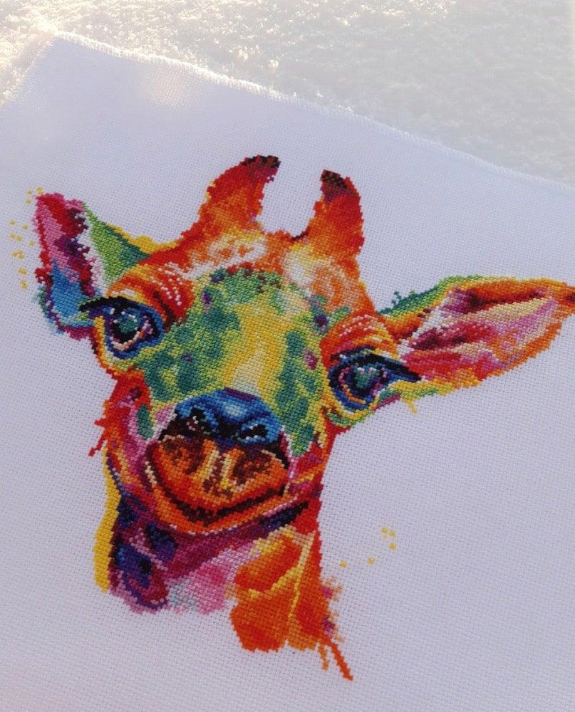 Giraffe 1434 Counted Cross Stitch Kit with colorful threads and canvas.