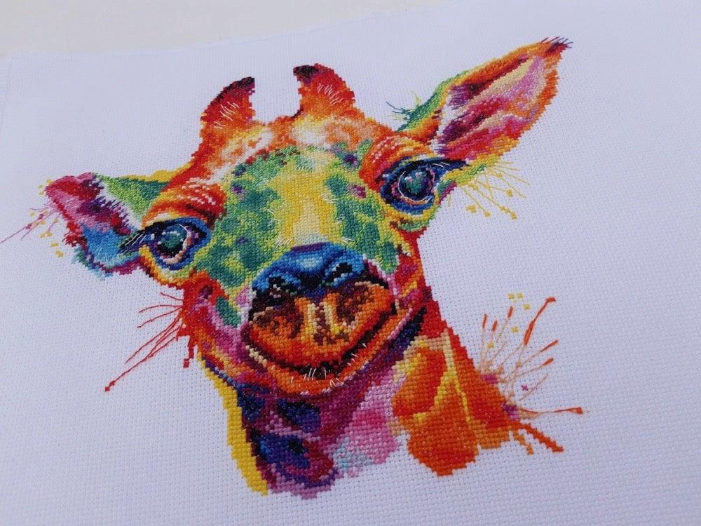 Giraffe 1434 Counted Cross Stitch Kit with colorful threads and canvas.