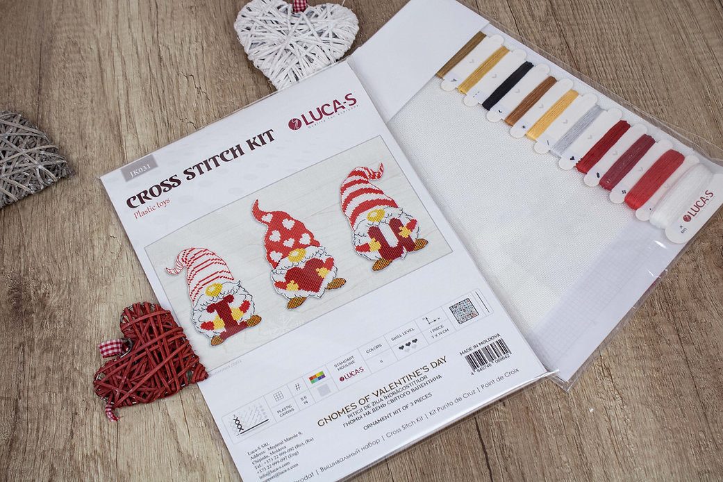 Gnomes of Valentine's Day cross-stitch kit featuring colorful threads, needle, and Aida canvas.
