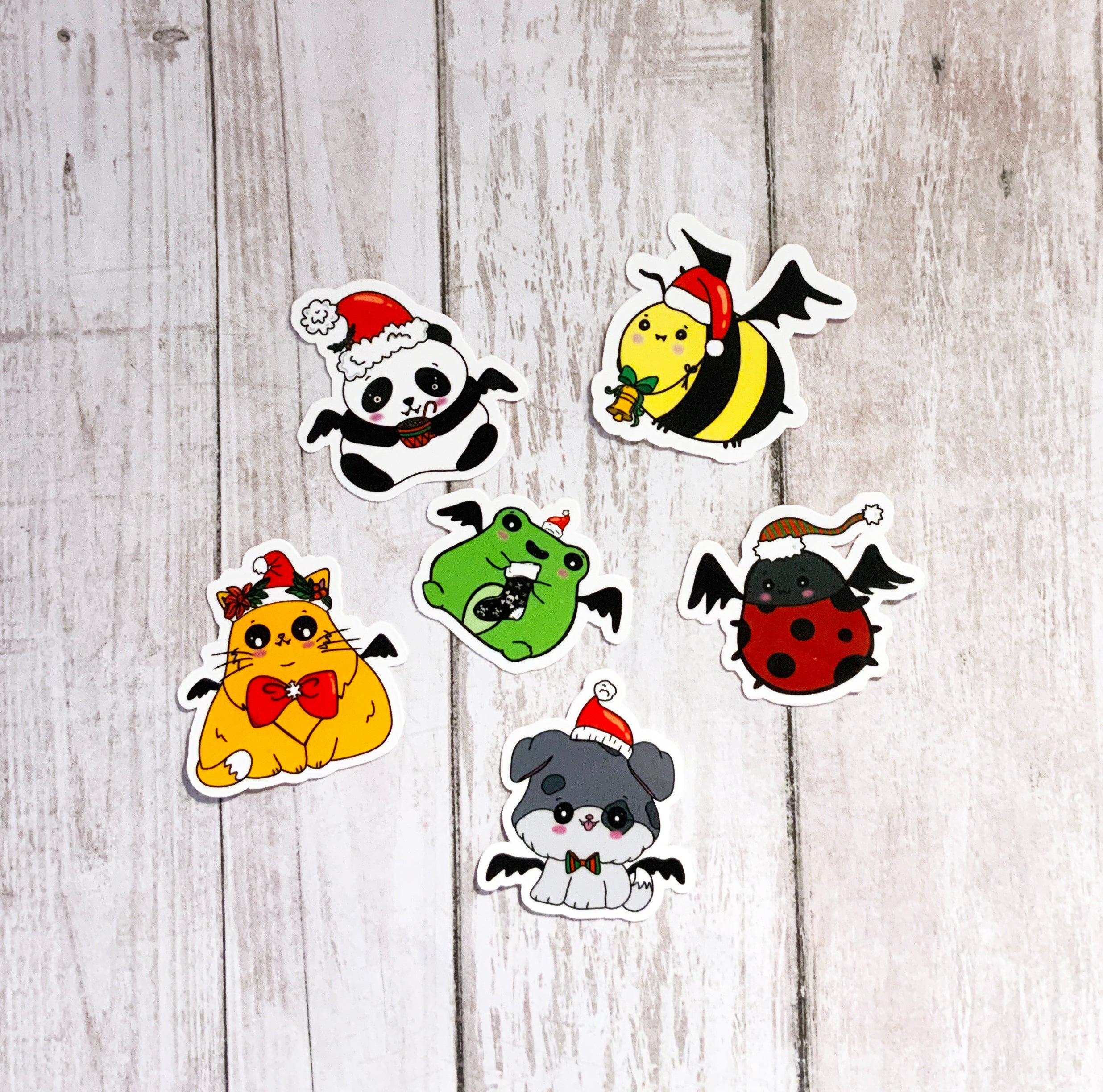 A pack of six goth-themed Christmas animal vinyl stickers featuring unique designs, perfect for festive decoration.