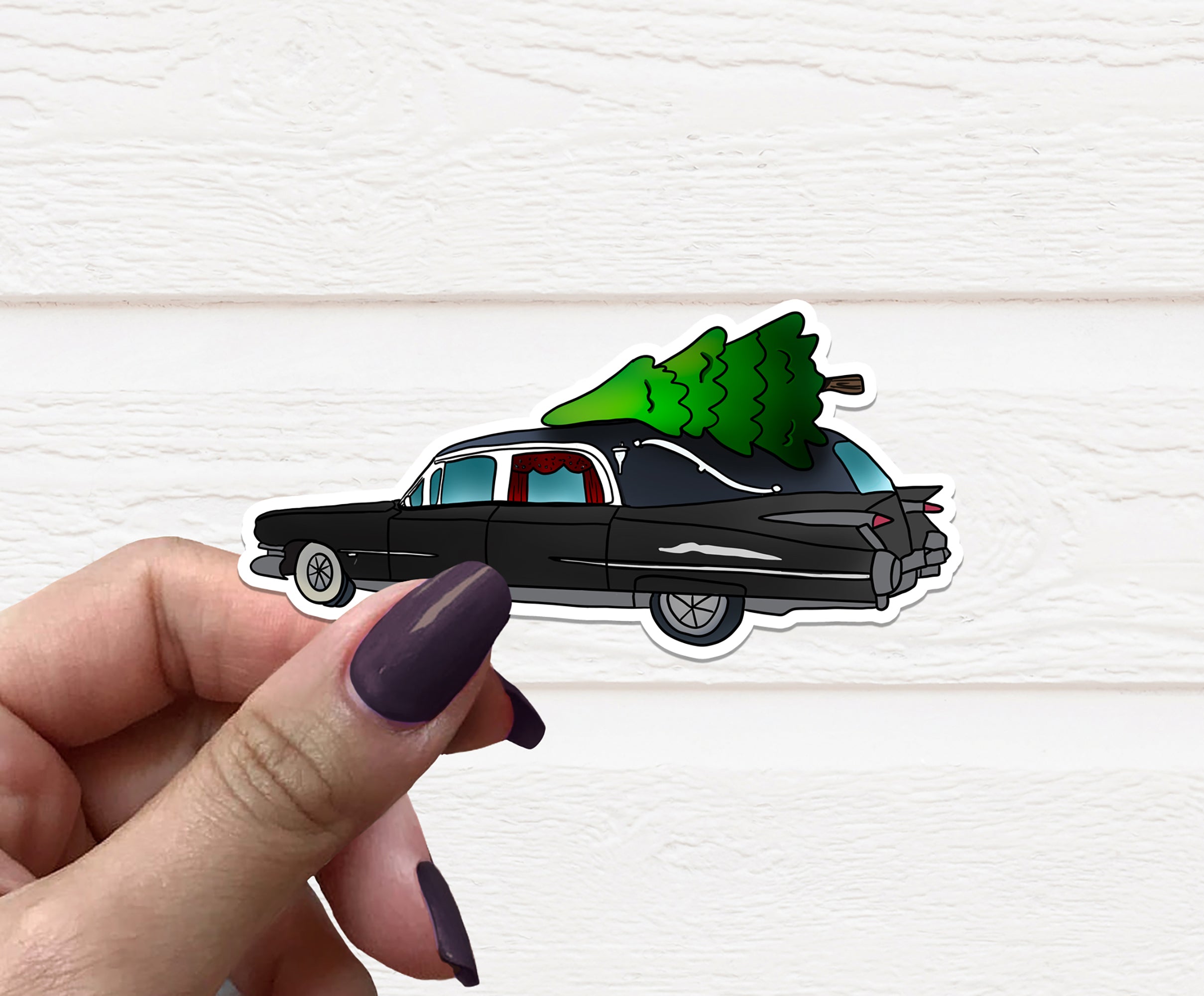 Gothic Christmas Hearse Vinyl Sticker featuring a whimsical hearse design, perfect for holiday decorations.