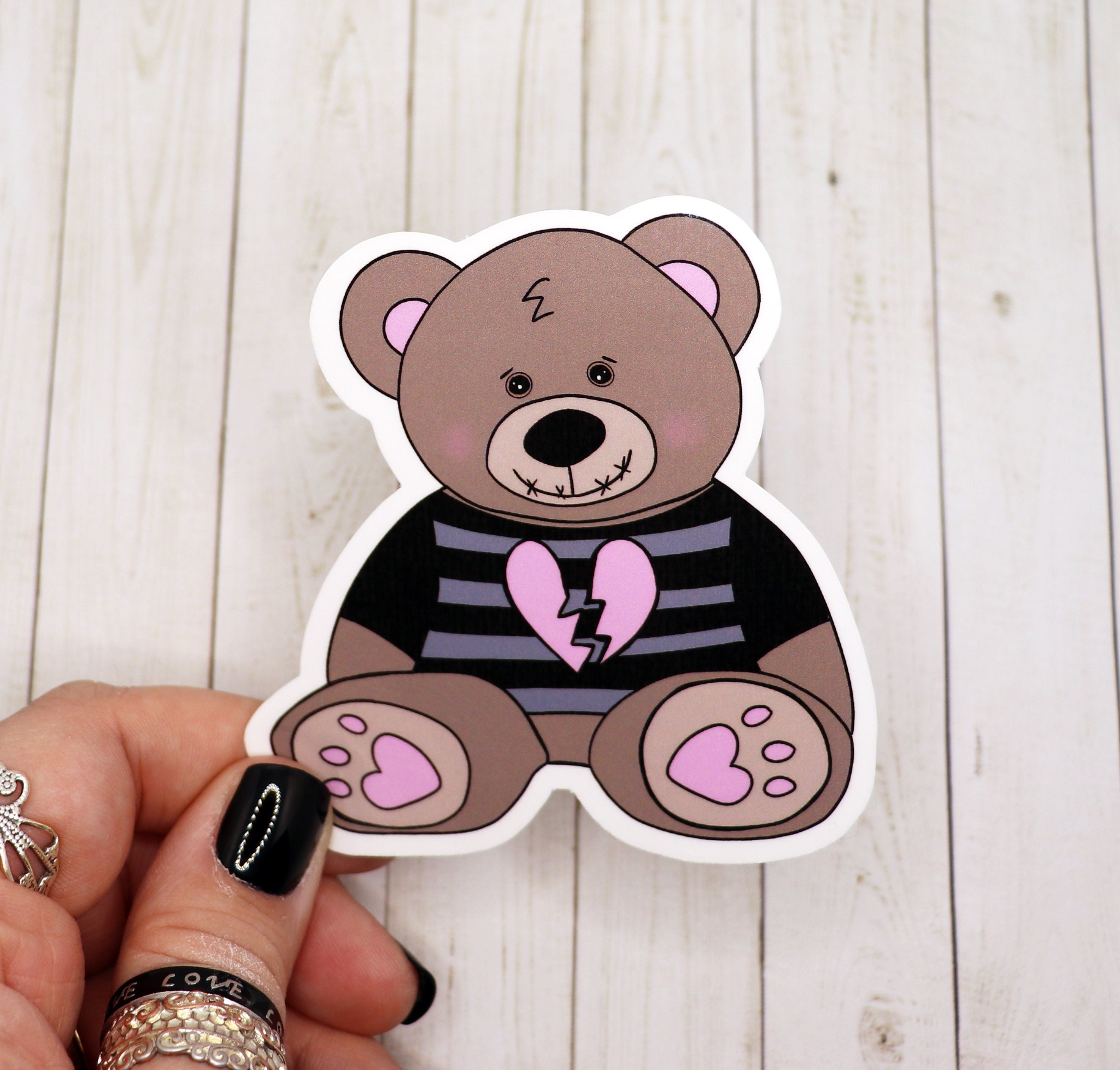 Gothic teddy bear vinyl sticker on a matte surface, showcasing intricate design and vibrant colors.