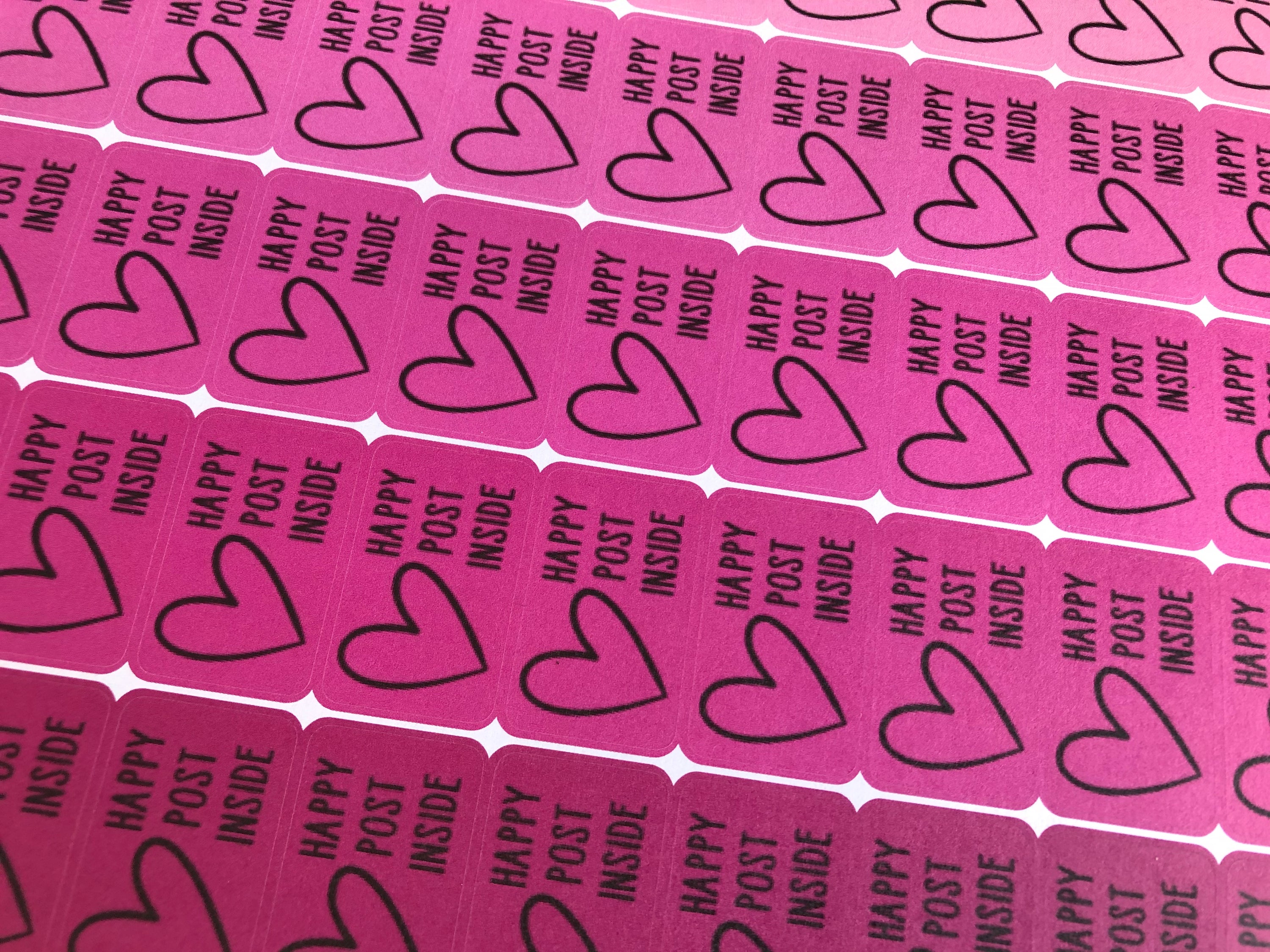 A collection of Happy Post Stickers - Seconds featuring cheerful designs with slightly pixelated text, perfect for crafting and correspondence.