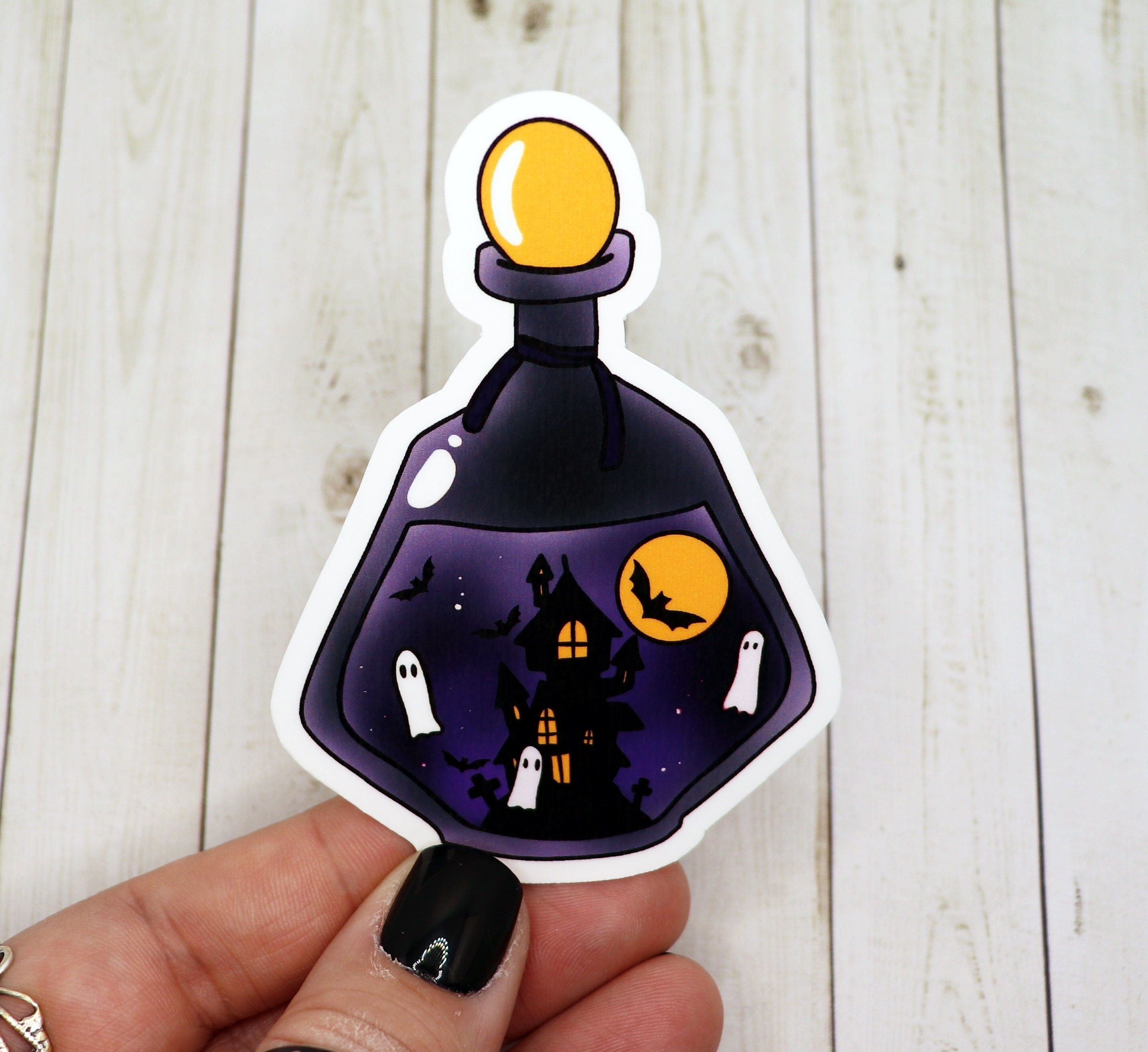 Haunted House Potion Bottle Sticker featuring a spooky design, perfect for Halloween decorations and personalizing items.