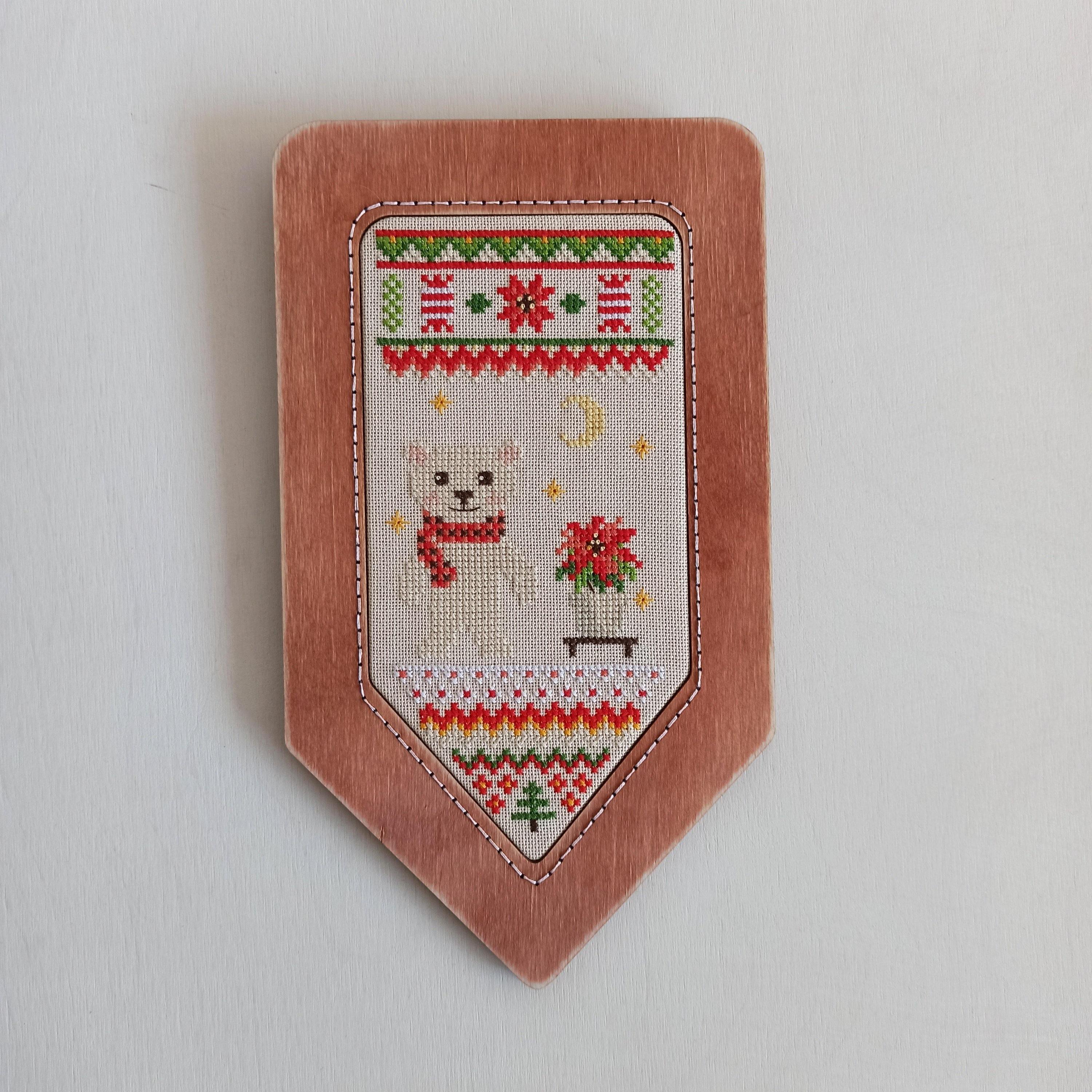 Holiday is Coming PM-05 Counted Cross-Stitch Kit featuring a white polar bear with red flowers, ideal for Christmas decor.