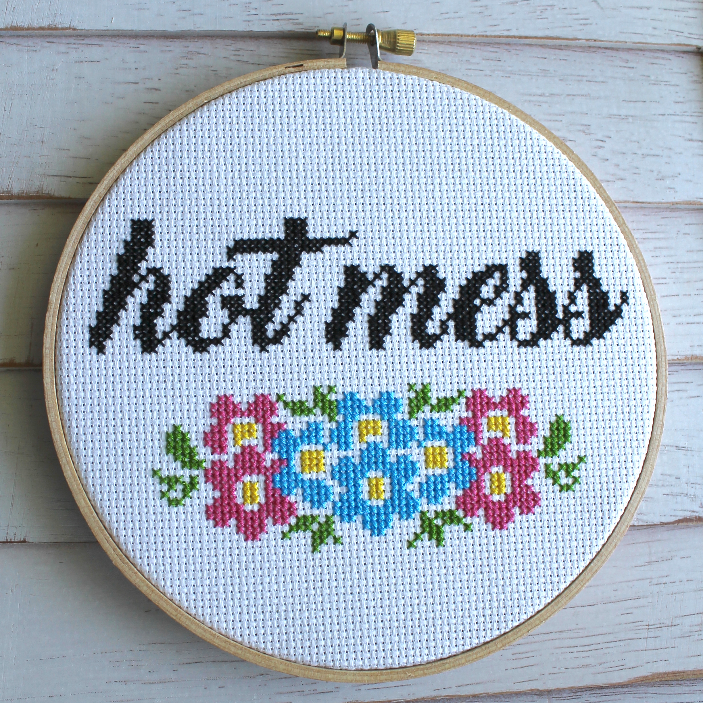 Hot Mess Counted Cross Stitch DIY Kit featuring floral elements and the phrase 'hot mess', designed for intermediate stitchers.