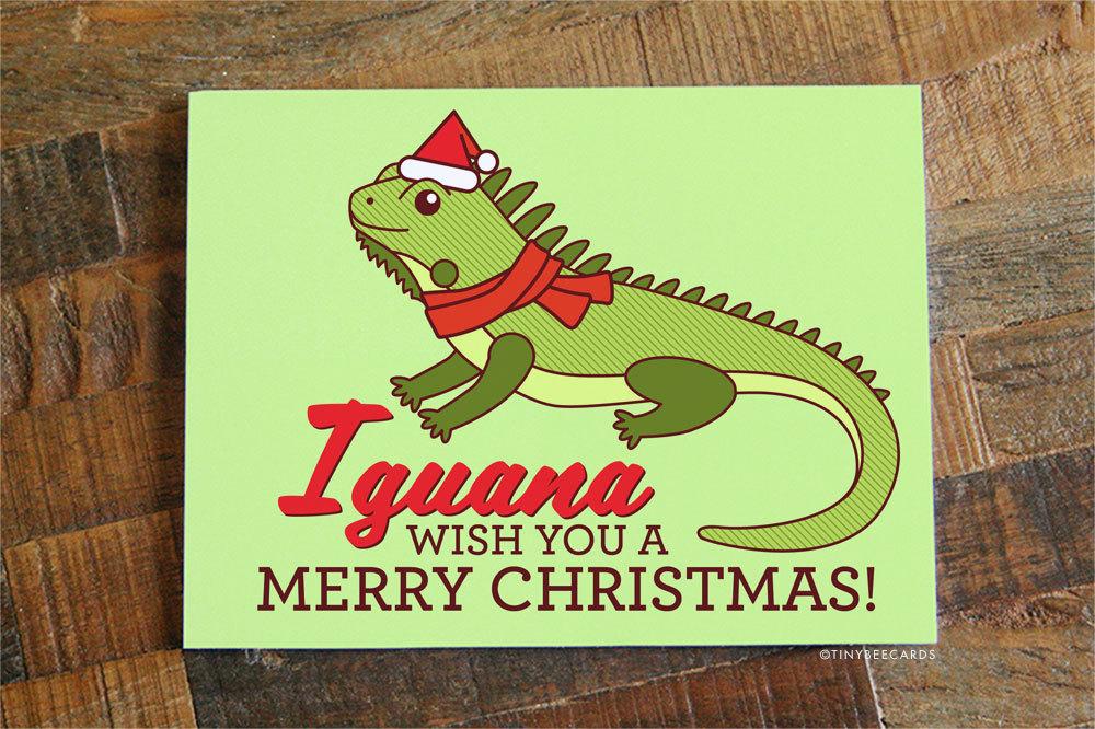 Iguana Pun Christmas Card featuring a playful iguana illustration with the text 'Iguana Wish You A Merry Christmas!'
