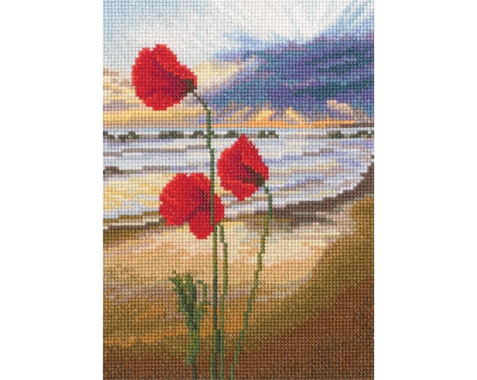 In the Moment M959 Counted Cross Stitch Kit featuring white Aida fabric, colorful threads, and included stitching tools.