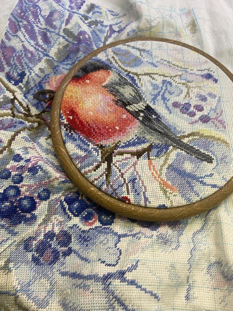 In the Snowing Forest SNV-665 Counted Cross Stitch Kit featuring 31 colors of cotton threads and 18 count AIDA canvas.