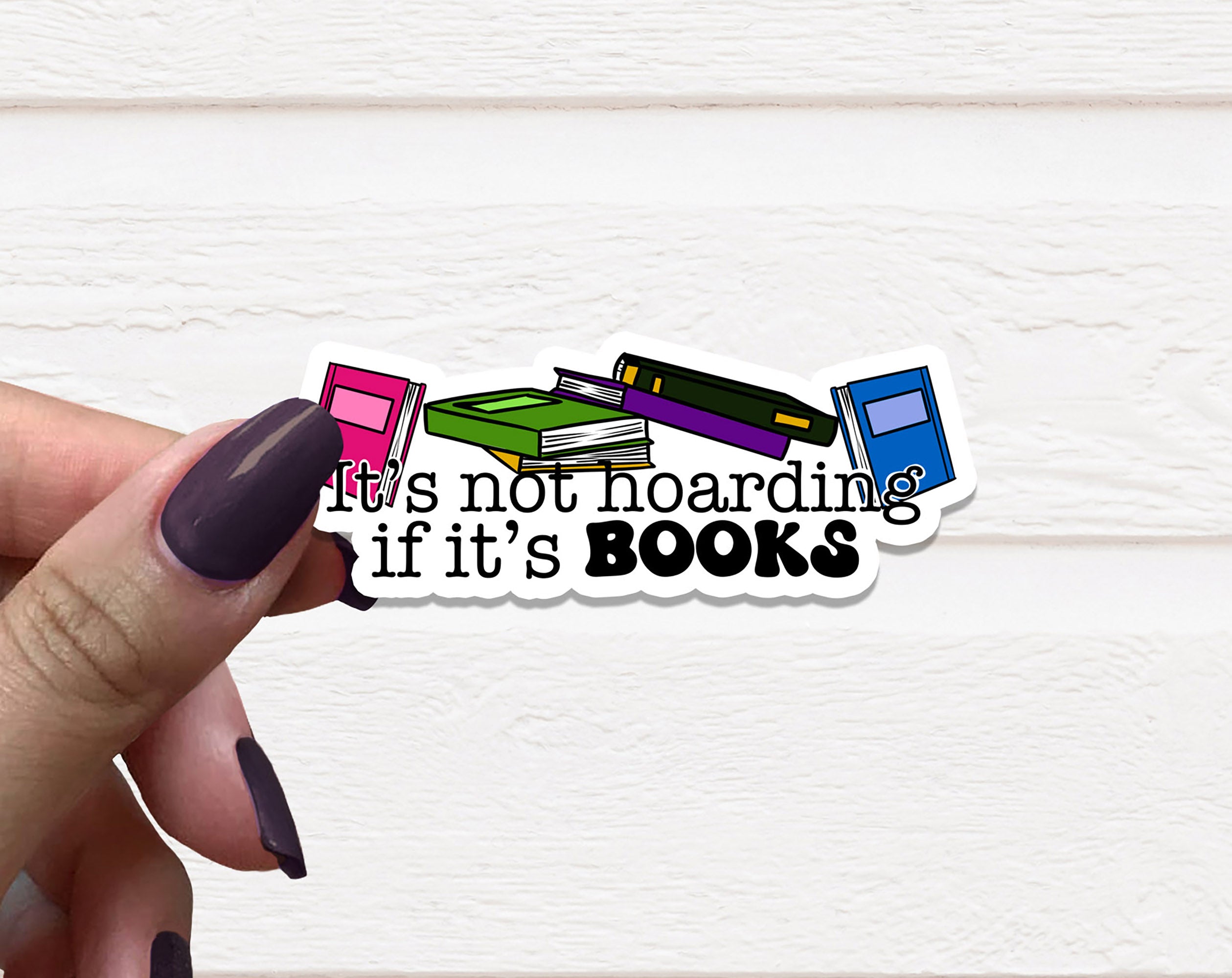 A 2.5-inch vinyl sticker featuring the phrase 'It's Not Hoarding If It's Books' on a matte background, perfect for book lovers.