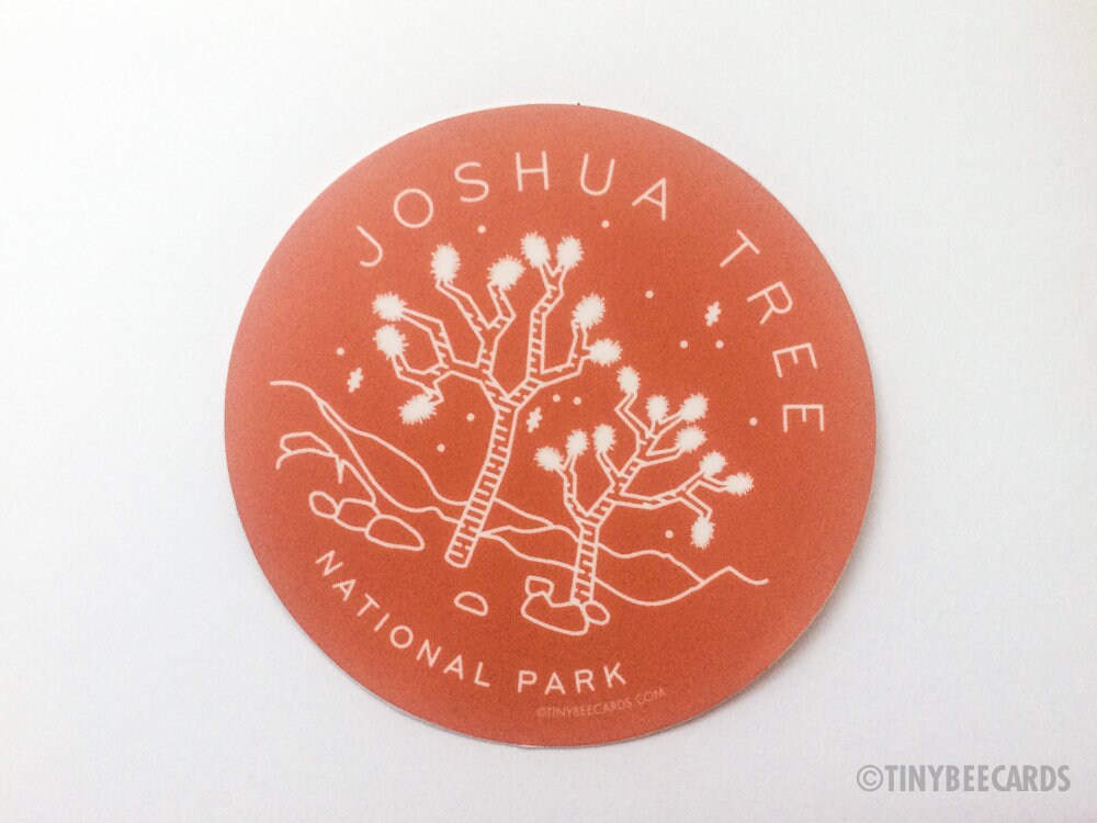 Joshua Tree National Park vinyl sticker featuring an illustration of Joshua Tree with a rust brown background and text.