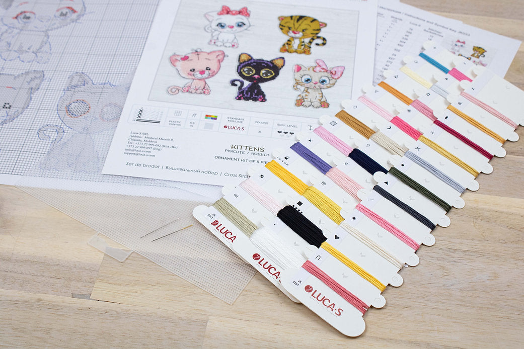 Kittens JK033L Counted Cross-Stitch Kit featuring colorful threads, Aida canvas, and a needle for crafting.
