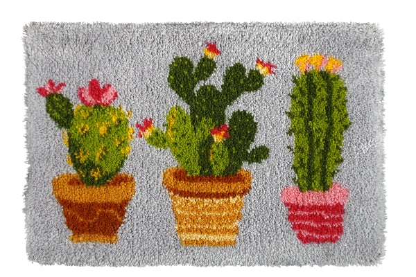 Latch hook rug kit featuring a modern cactus design with pre-cut yarn and latch-hook tool.