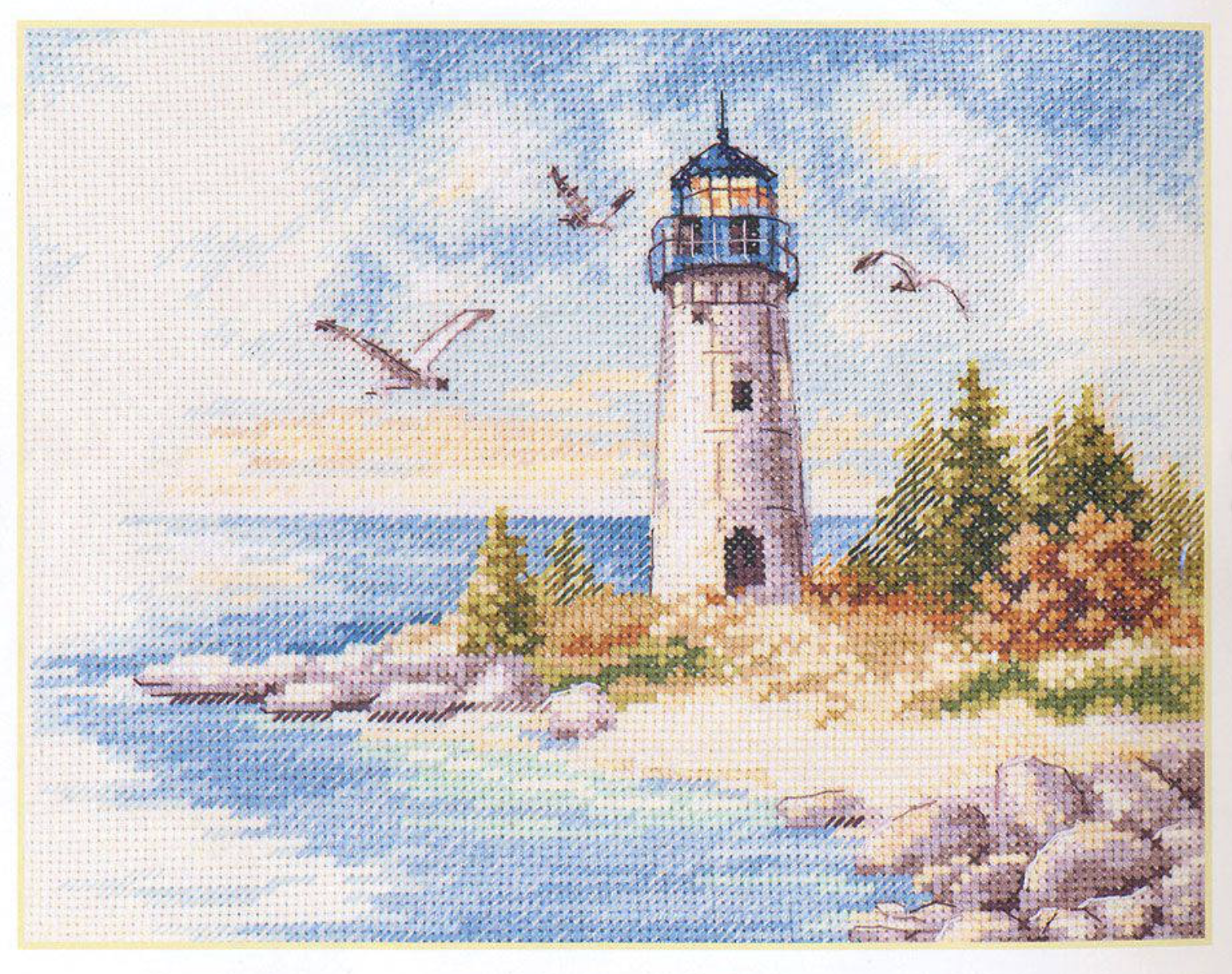 Lighthouse 3-26 Cross-stitch kit featuring white Aida fabric, colorful threads, and an embroidery needle.