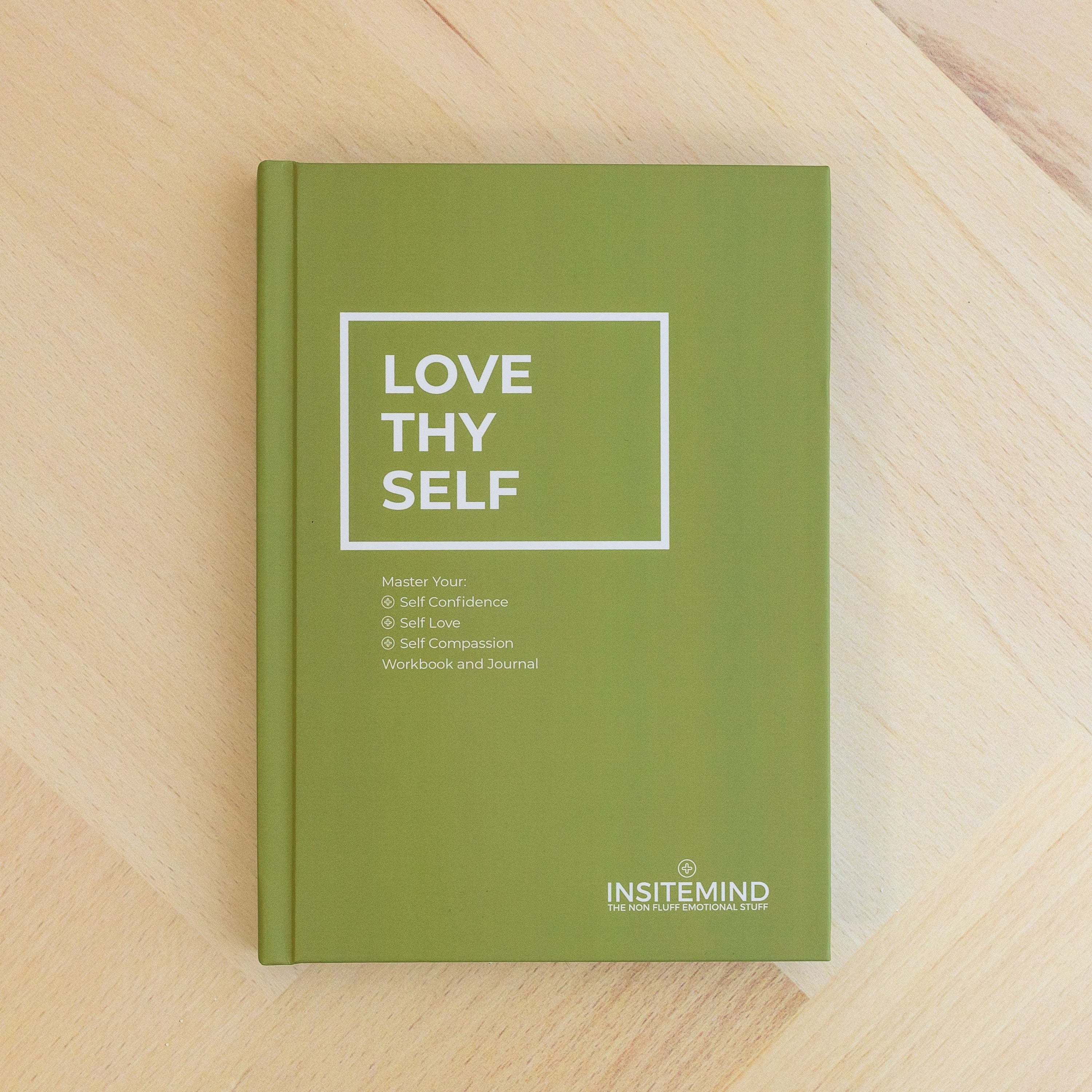 A beautifully designed A5 hardcover workbook titled 'Love Thy Self' featuring colorful pages and motivational quotes for self-love and personal growth.