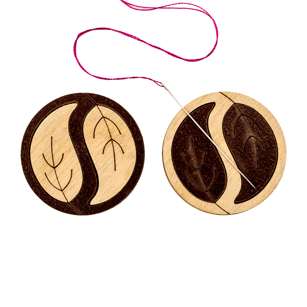 Magnetic double-sided needle holder FLMH-013(W) with strong neodymium magnets, designed for secure needle fixation during embroidery.