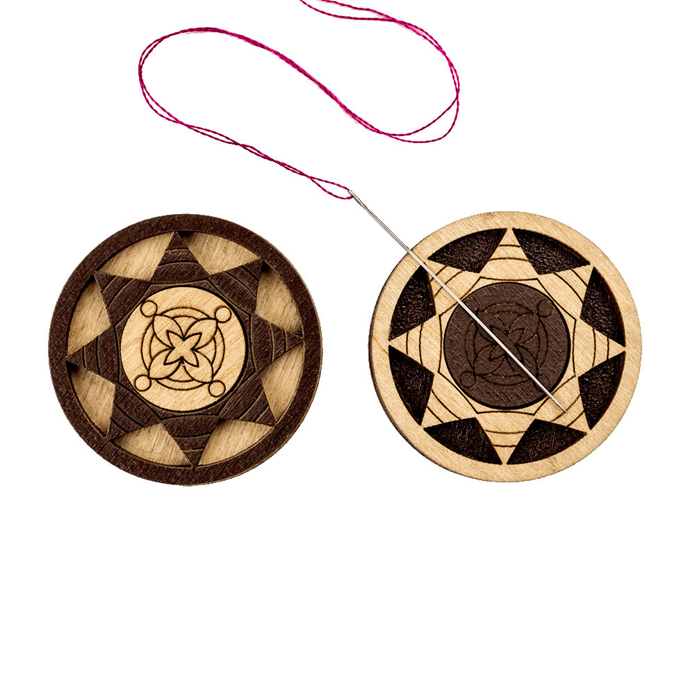 Magnetic double-sided needle holder FLMH-035(W) with strong neodymium magnets, elegantly designed for embroidery enthusiasts.