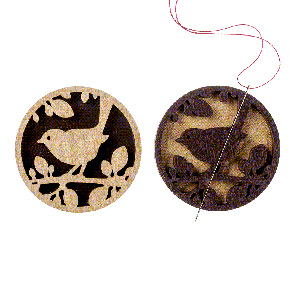 Magnetic double-sided needle holder FLMH-045(W) with strong neodymium magnets, elegantly designed for embroidery enthusiasts.