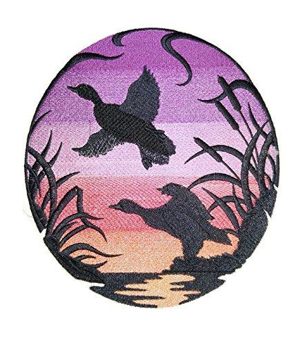 Mallards Silhouette at Sunset embroidered patch showcasing intricate design and vibrant colors, ideal for iron-on or sewing applications.
