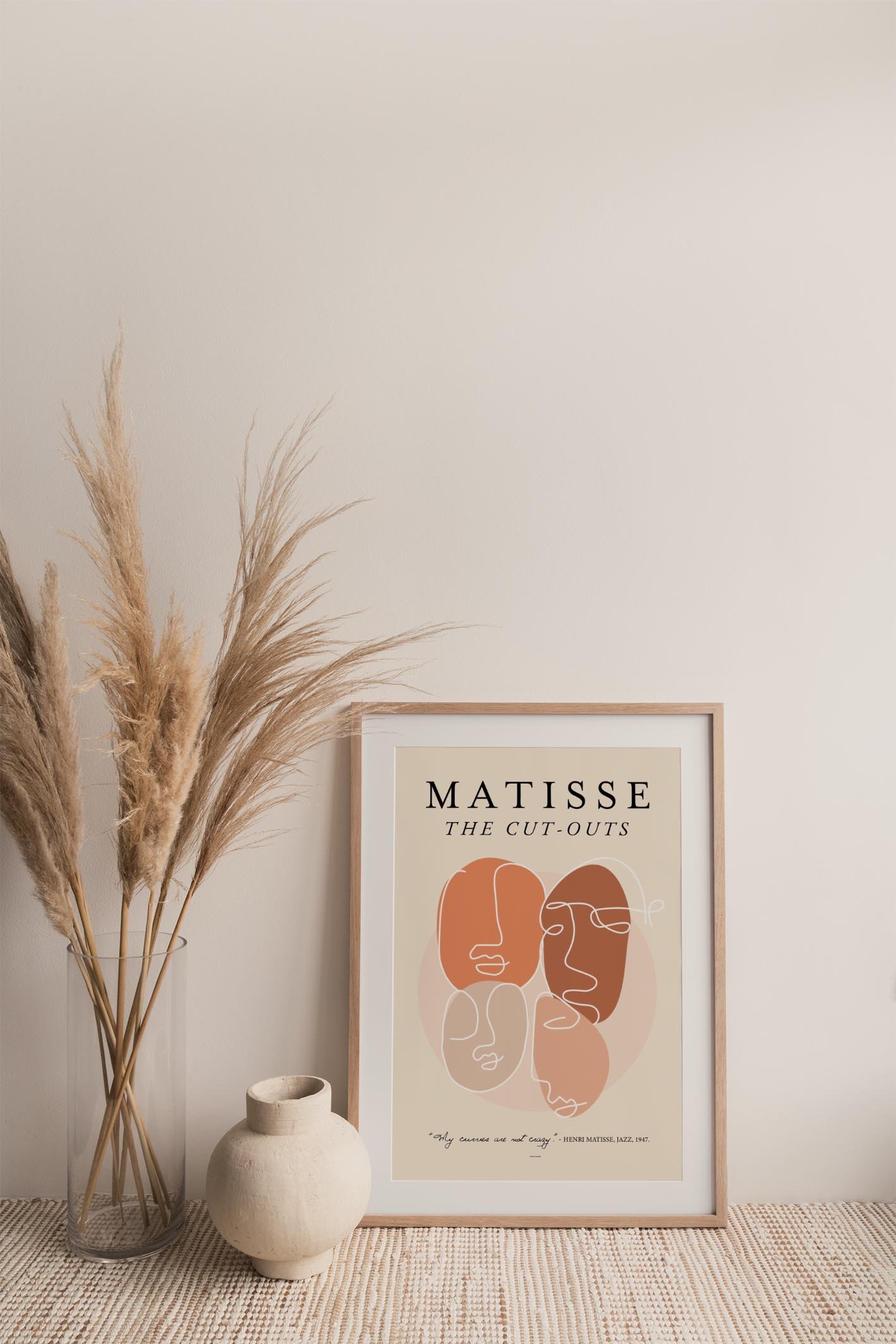 A vibrant collection of Matisse-inspired face cutouts featuring colorful shapes and expressive designs, perfect for home decor.