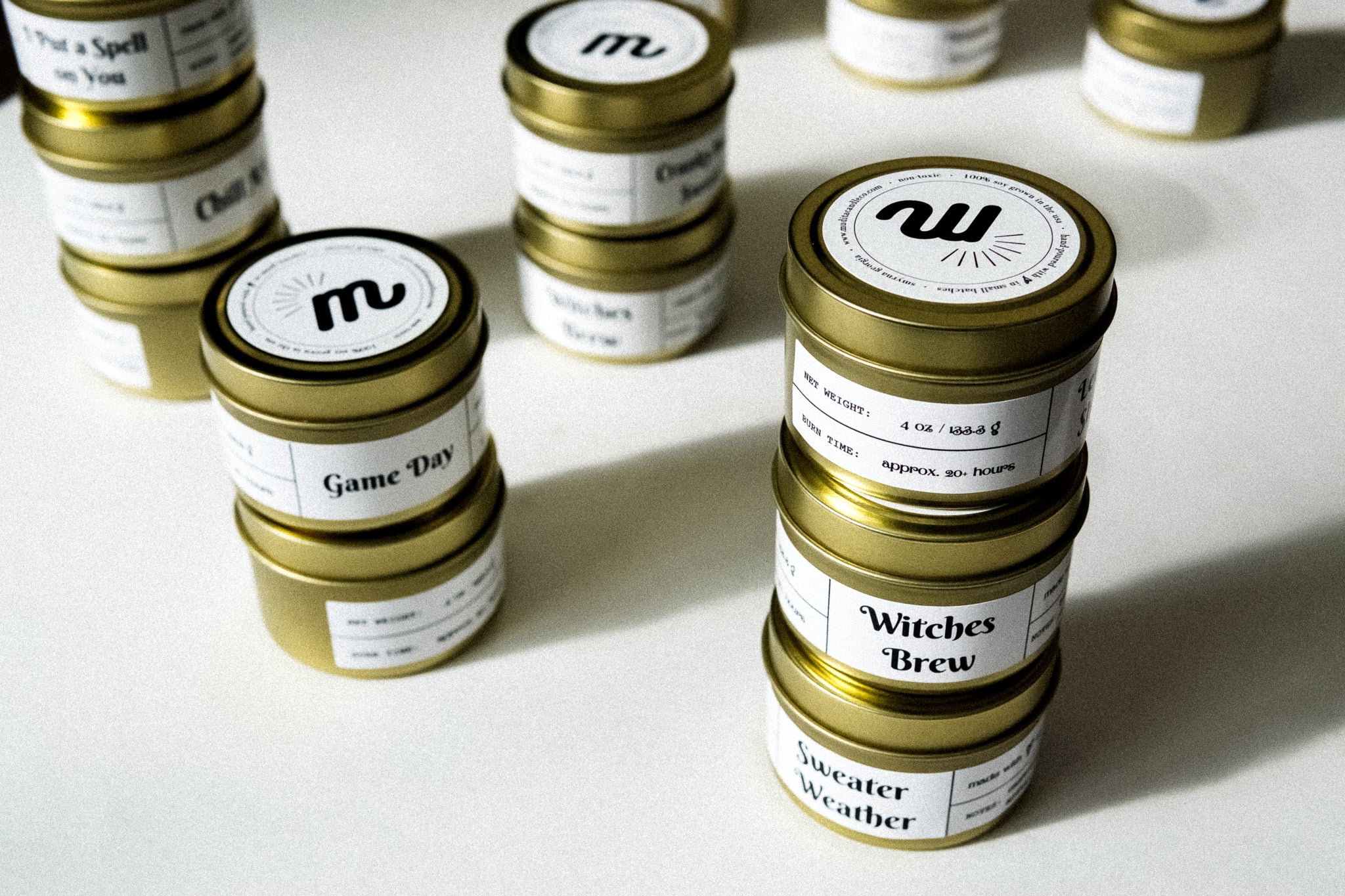 Merry & Lit candle in a 4oz jar, featuring a warm blend of cinnamon, fir needles, clove, and vanilla, designed for a cozy atmosphere.