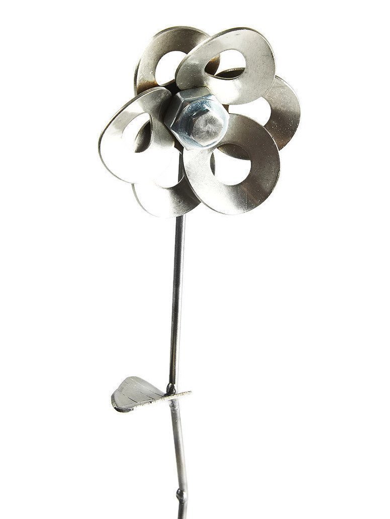 Handcrafted metal flower made from recycled steel, displayed in a matching steel vase, showcasing unique design and craftsmanship.