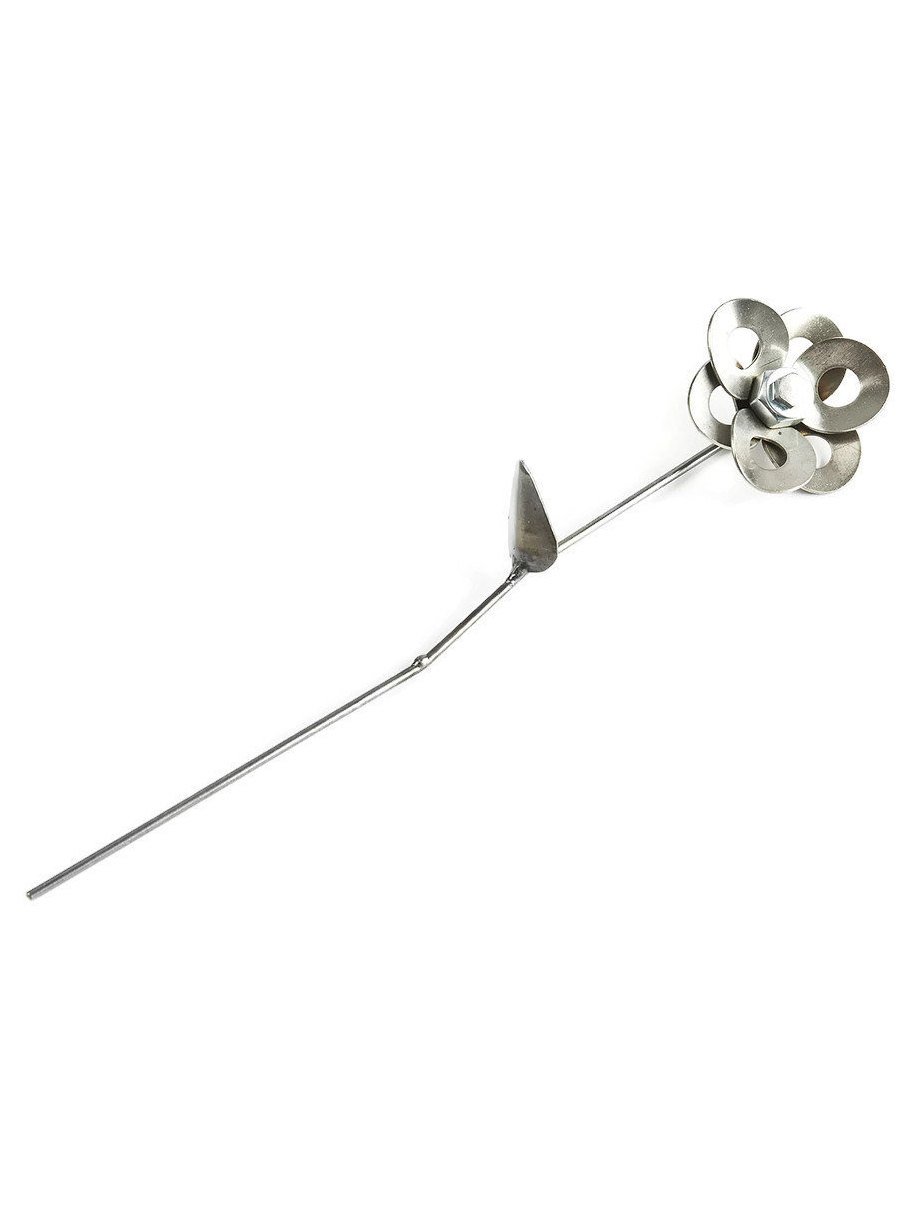 Handcrafted metal flower made from recycled steel, displayed in a matching steel vase, showcasing unique design and craftsmanship.