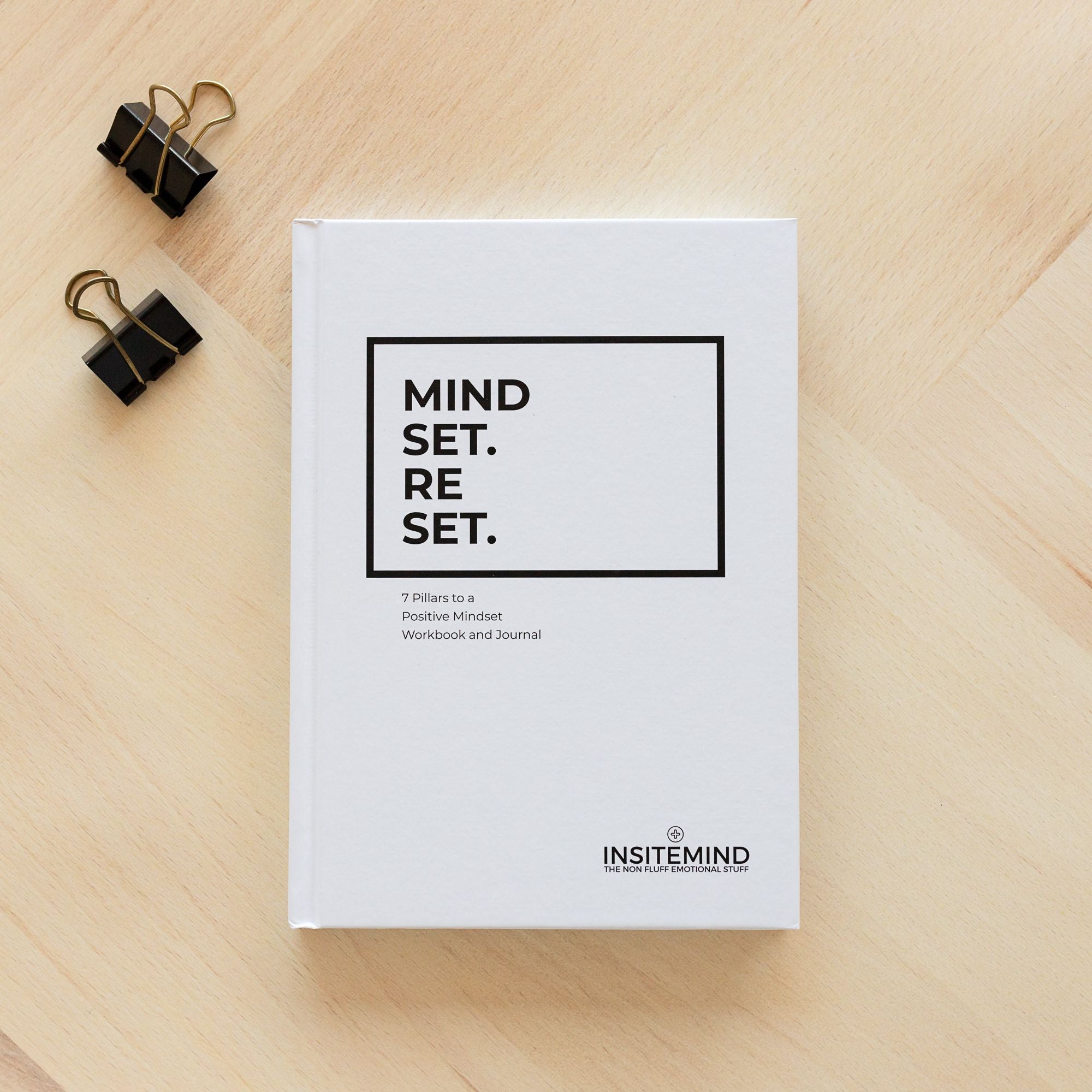 Mindset Reset Workbook and Journal featuring a beautiful cover design, open to a page with guided exercises and reflections.
