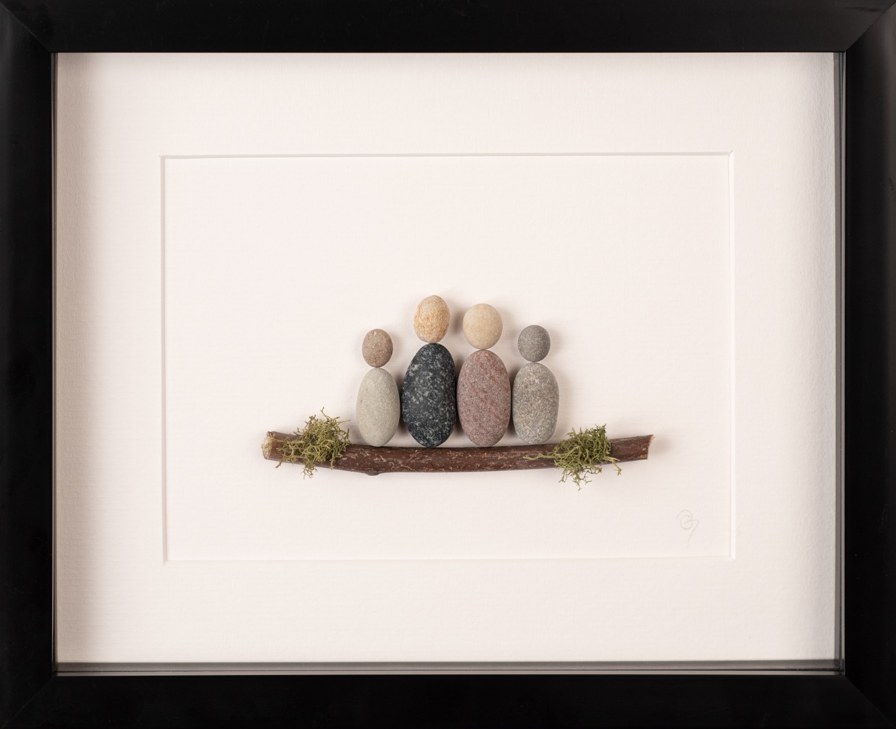A beautifully crafted Mini Family artwork framed in white, showcasing unique natural materials representing family bonds.